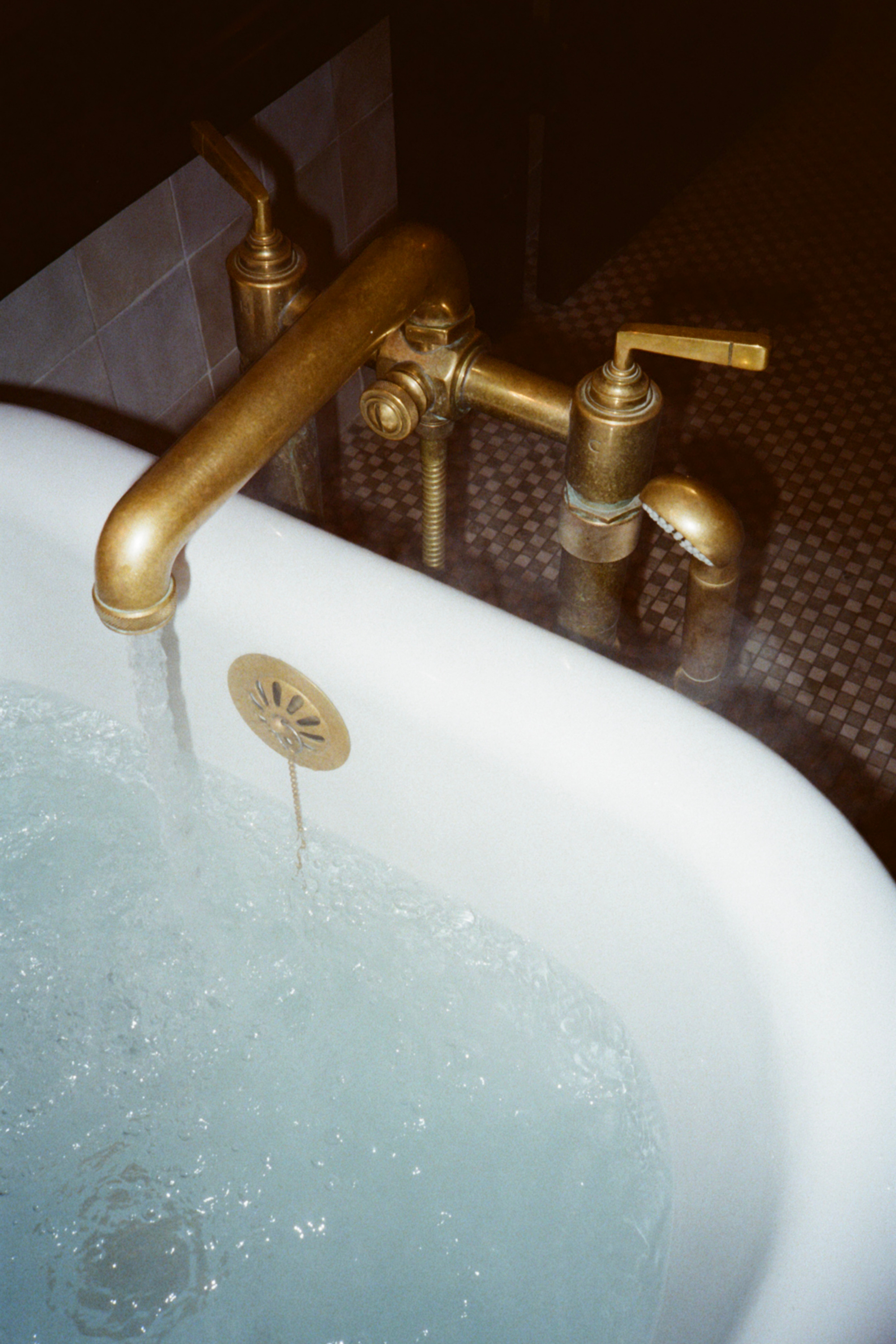 Film photo of filled tub with steam