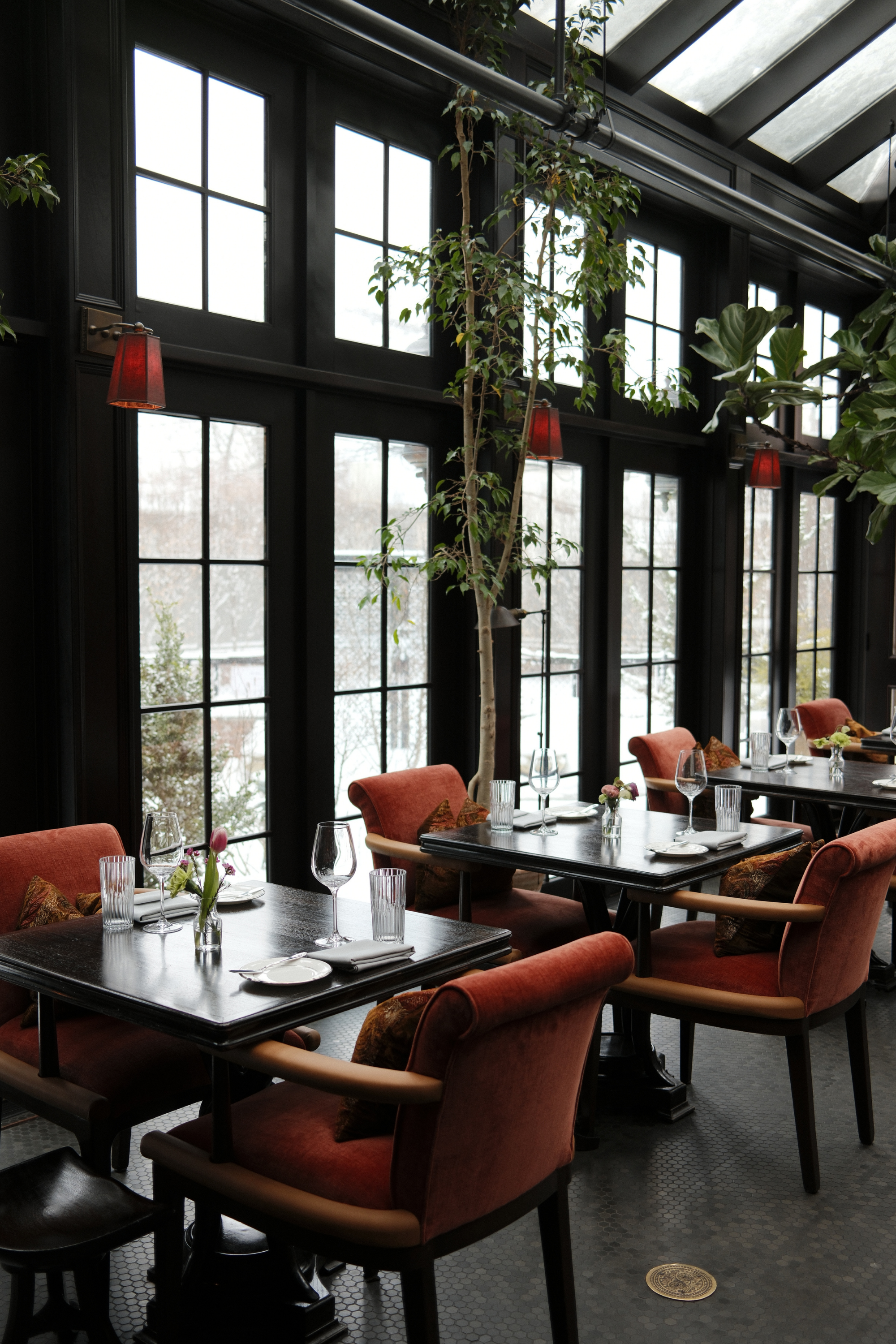 SERRE restaurant seating in front of windows