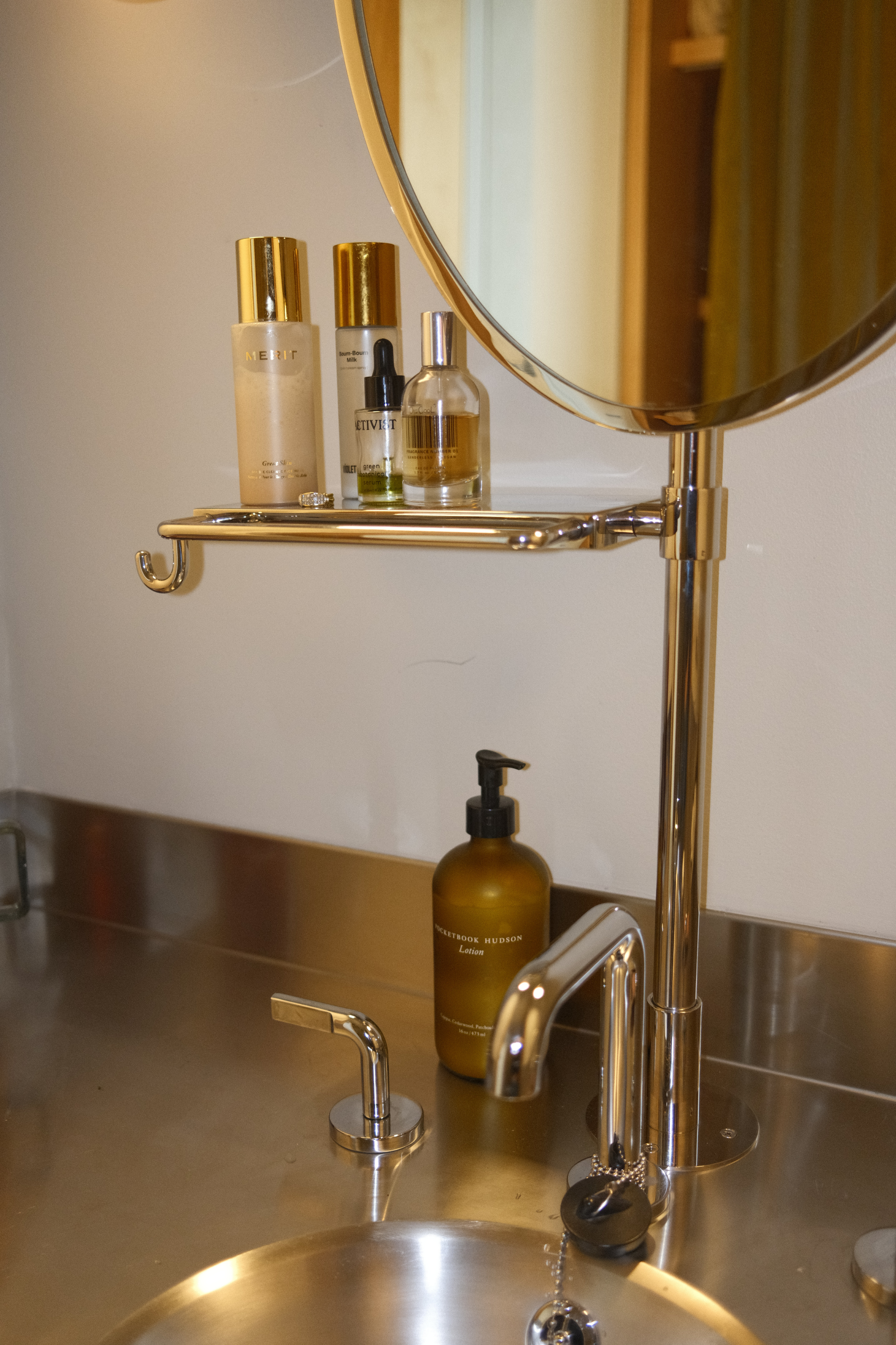 Bathroom vanity and sink with beauty products