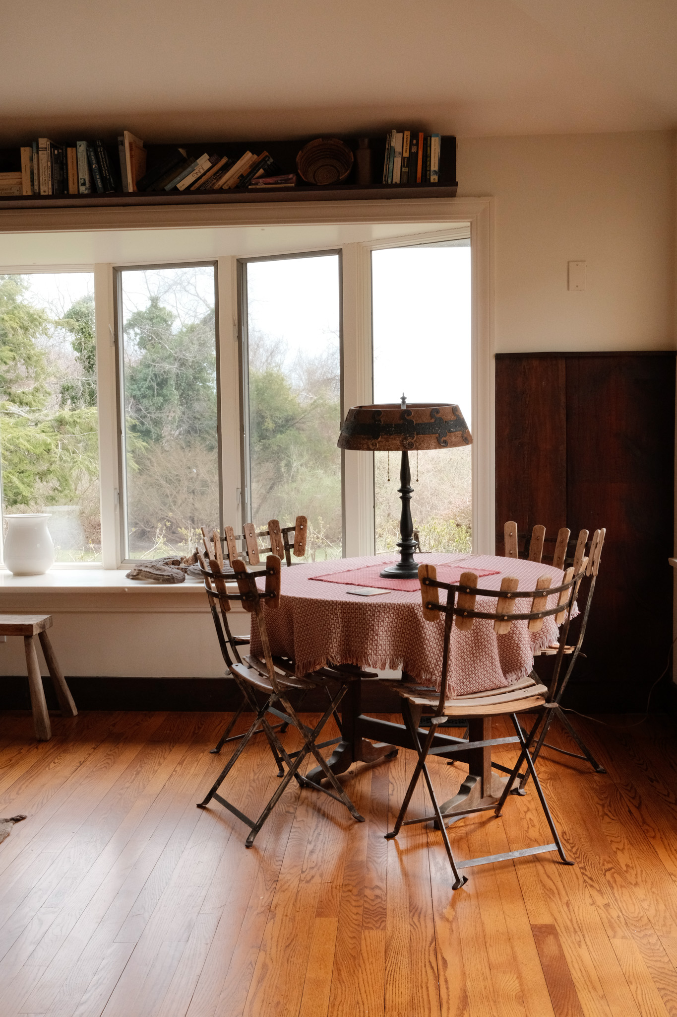 Table with antique lamp and chairs