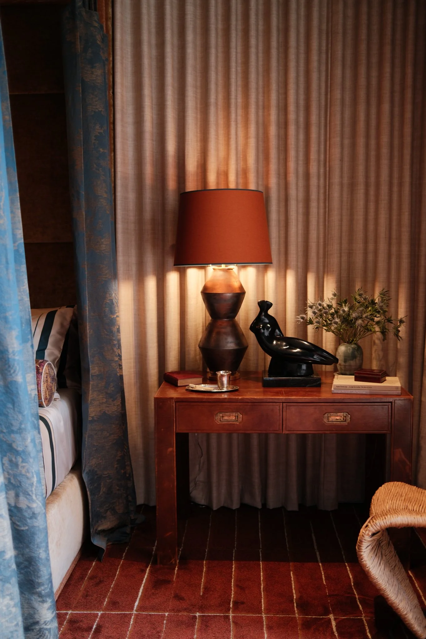 nightstand with lamp and decor
