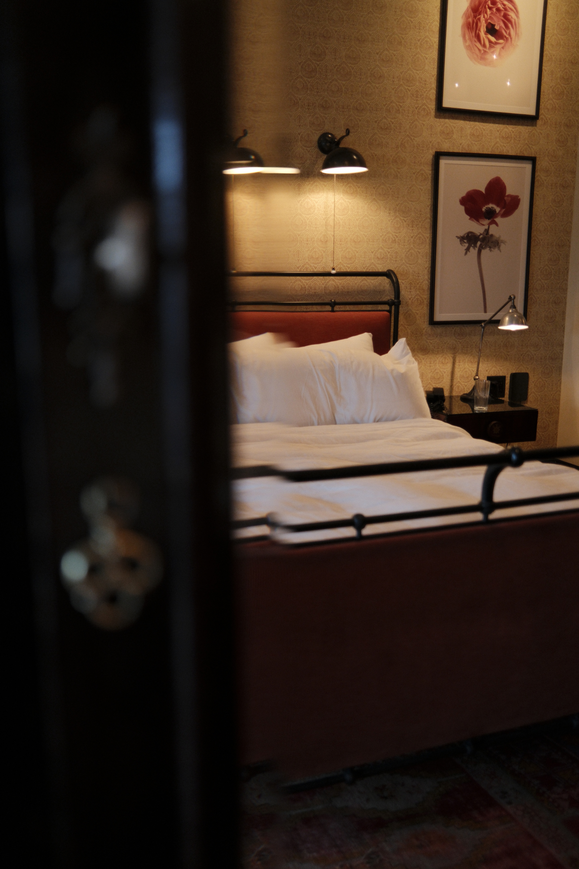 Bed reflected in the armoire mirror