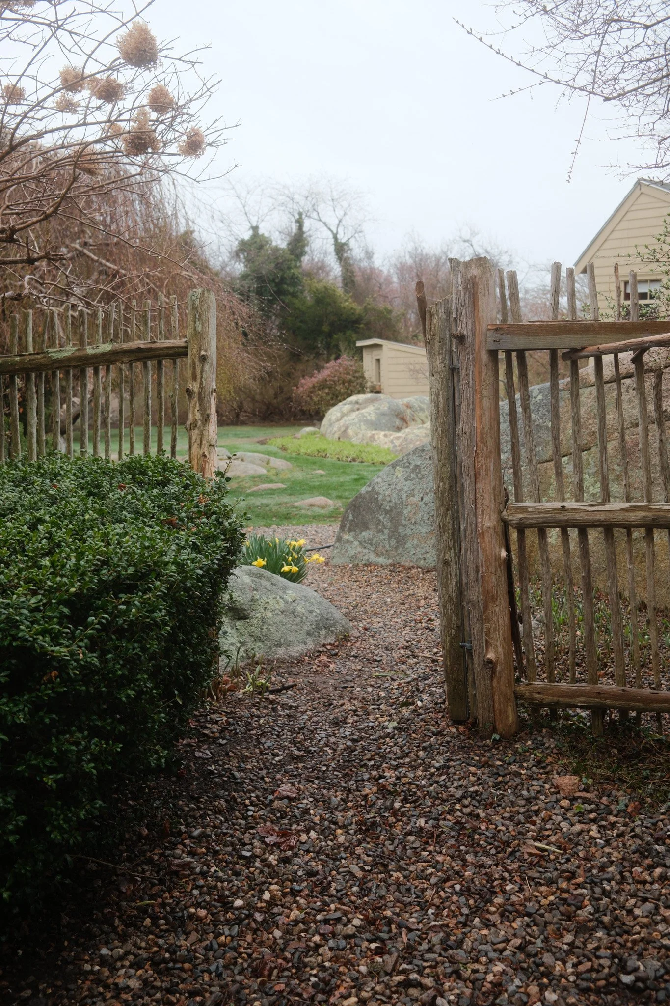 Garden entrance with wooden fence