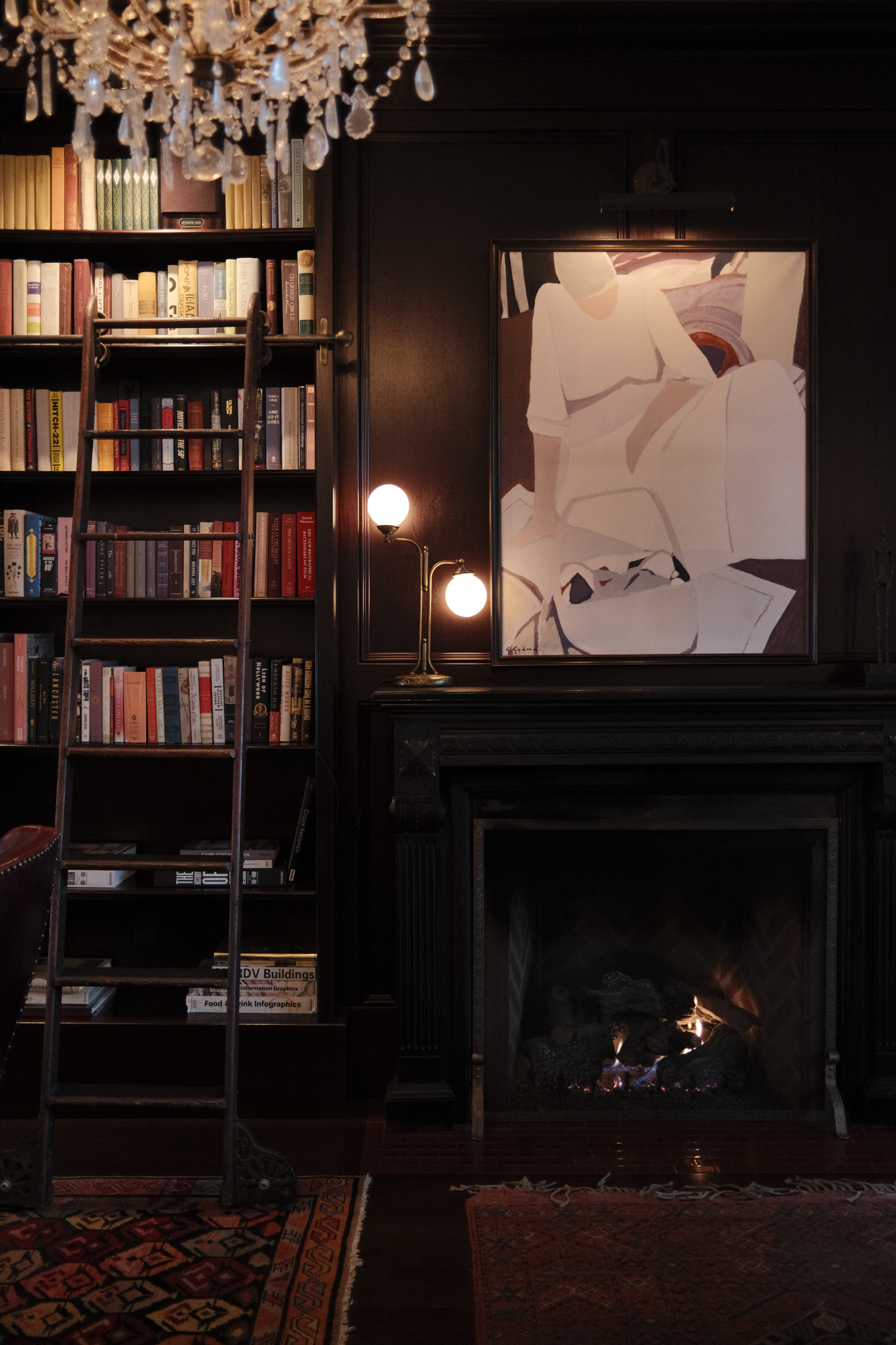 Library fireplace and bookshelves