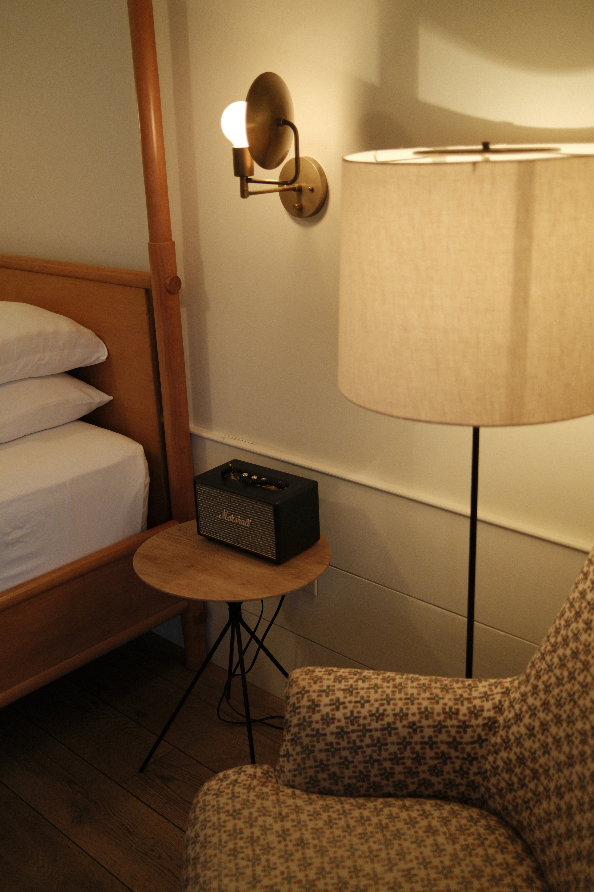 Guest room side table with a speaker