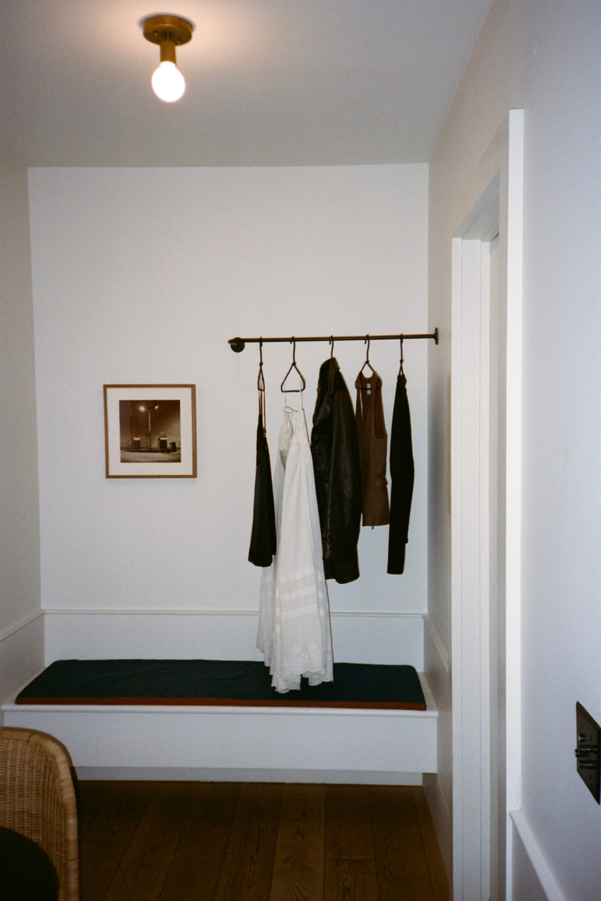 Guest room clothes rack with clothing