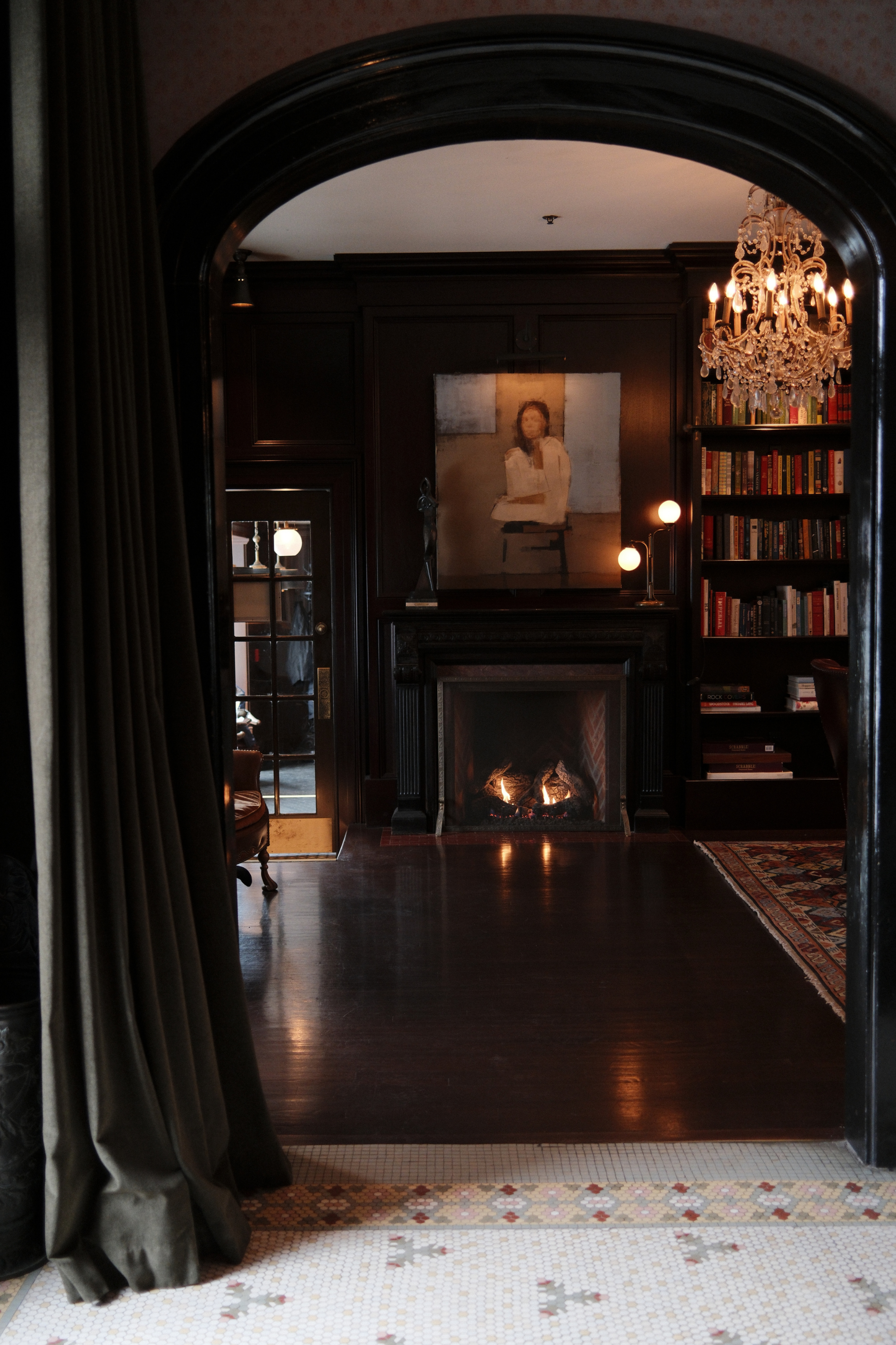 Library entrance with fireplace and bookshelves