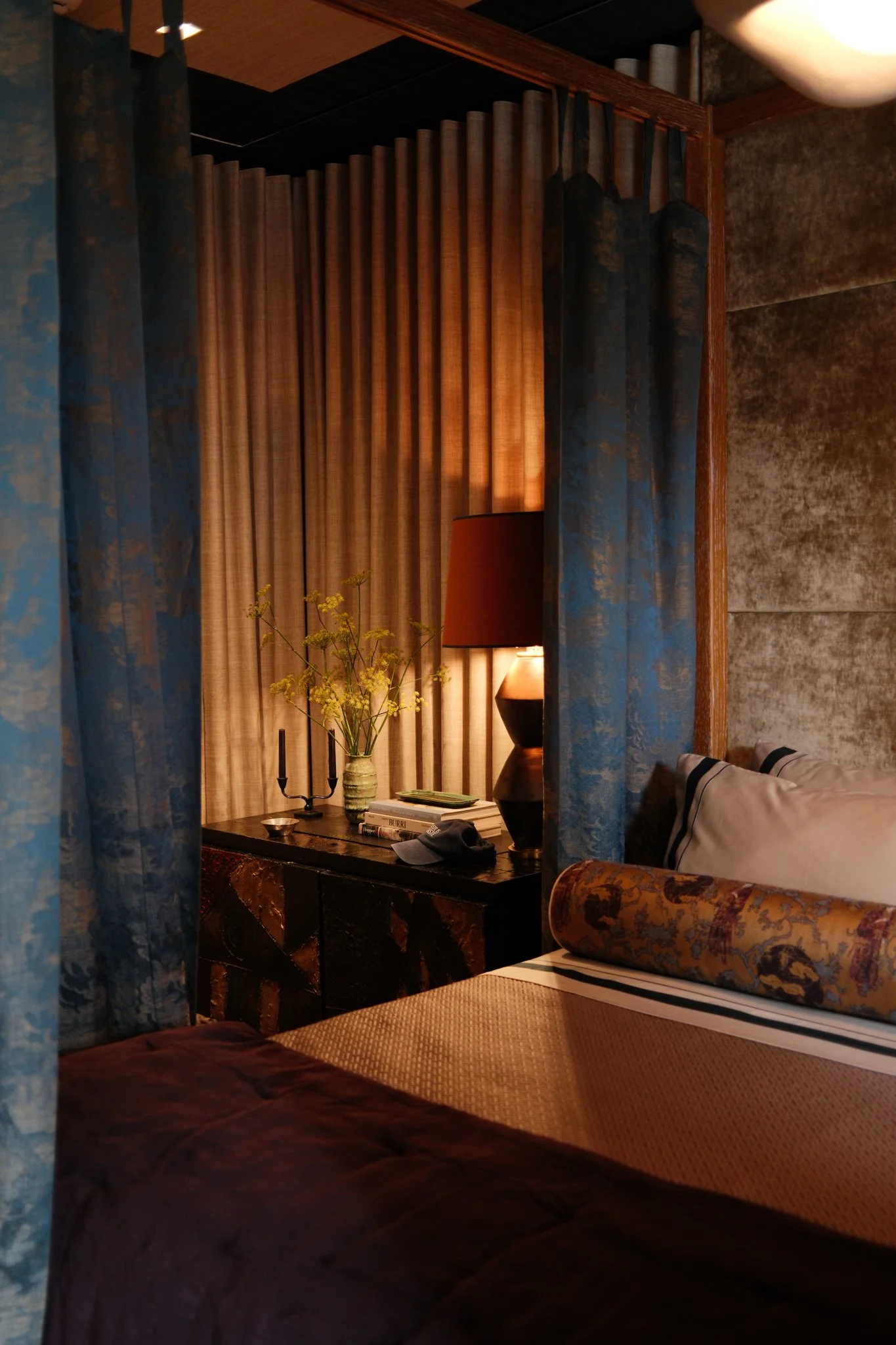 canopy bed and nightstand with decor