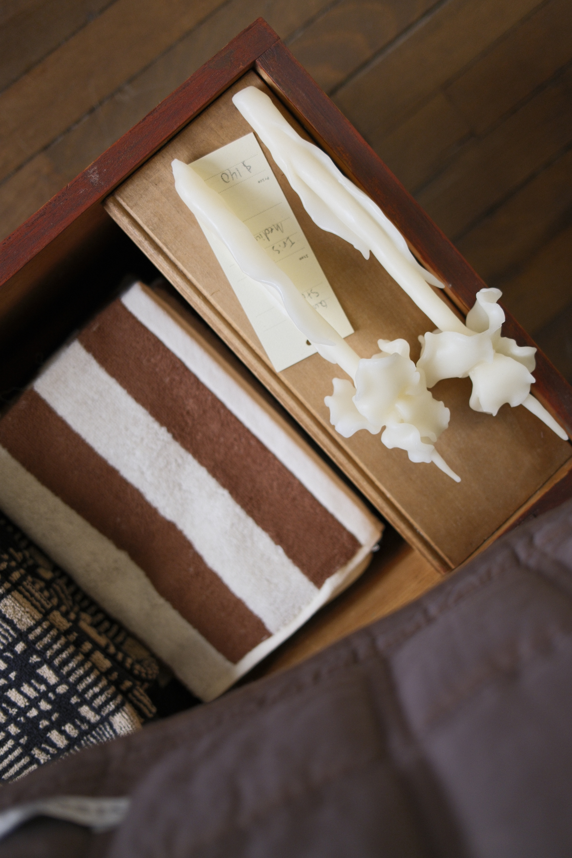 Decorative candles and towels displayed at Show:Room