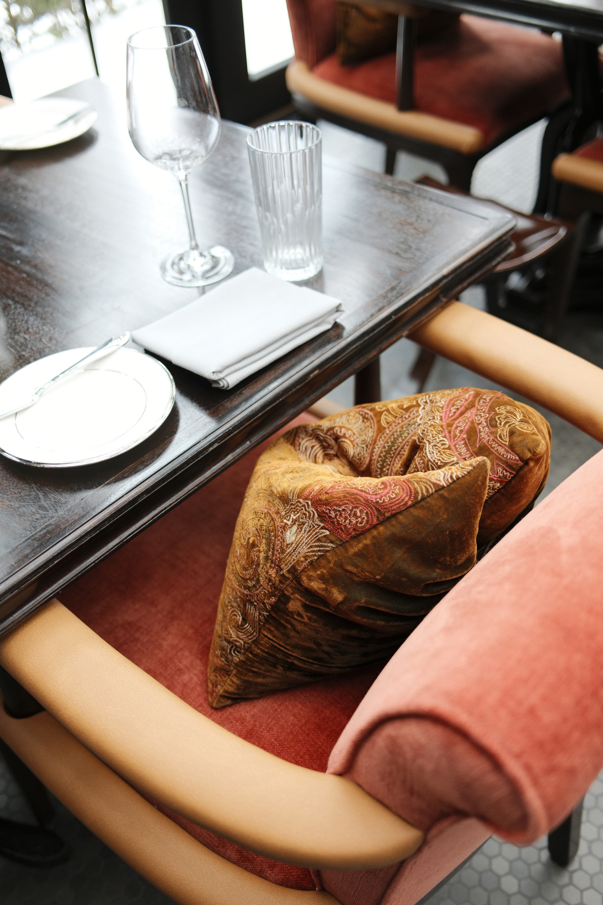Restaurant table with a pillow in the chair