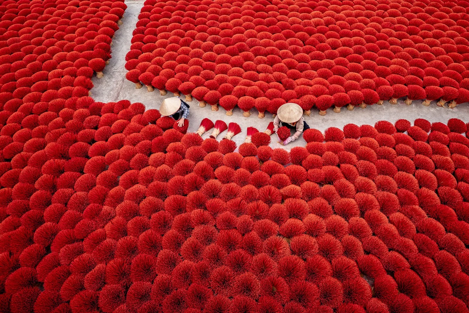 Workers-Arranging-Red-Incense-Sticks-for-Drying-ago.2024.jpg