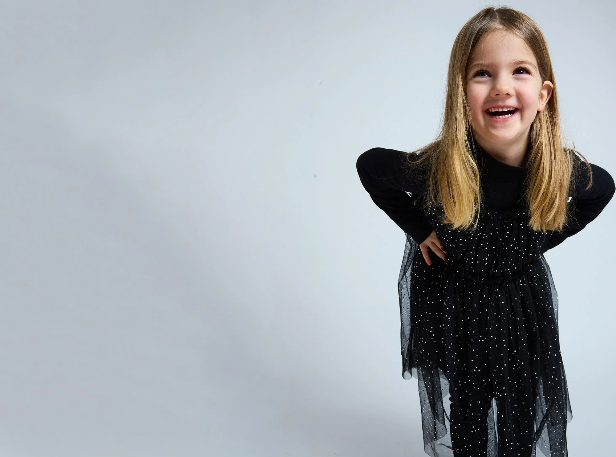 girl laughing with hands on hips during kids portrait mini session Brooklyn NYC