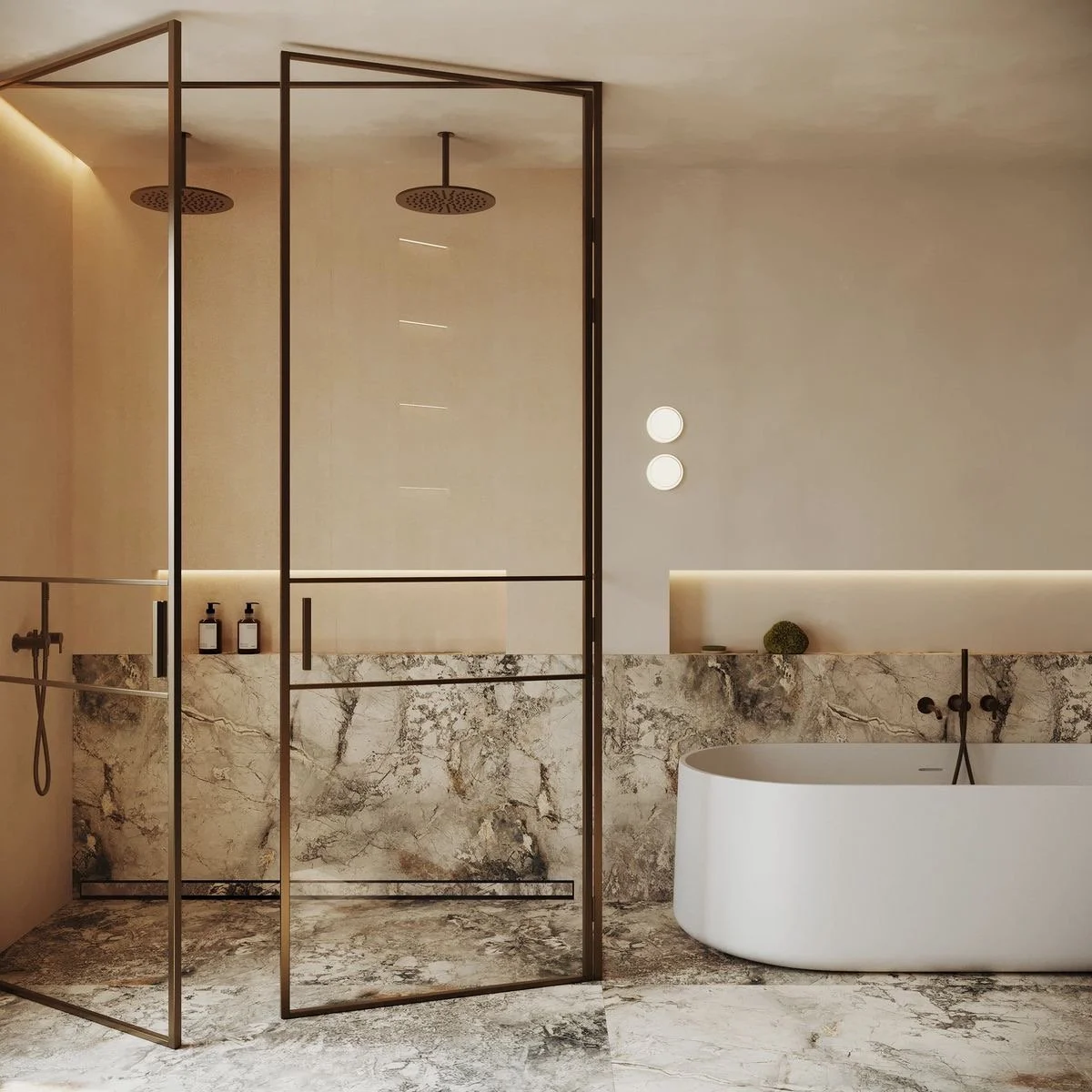 An oval mirror with a backlit frame mounted on a polished marble wall, with a gold faucet and sink below.