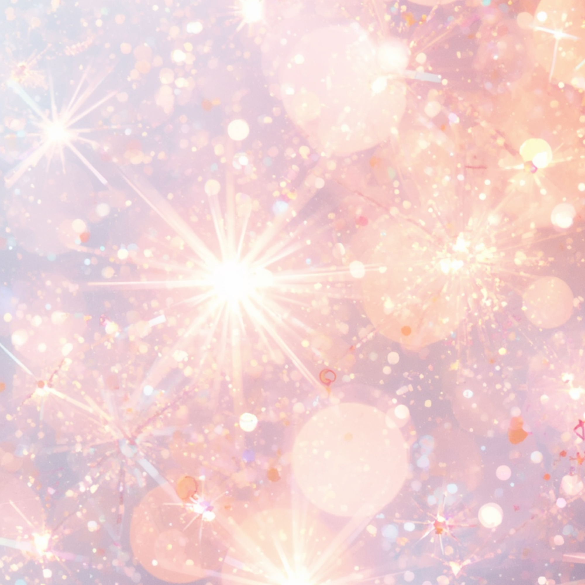 Colorful display of lights and sparks resembling fireworks or sparklers, with pink, orange, and white hues.