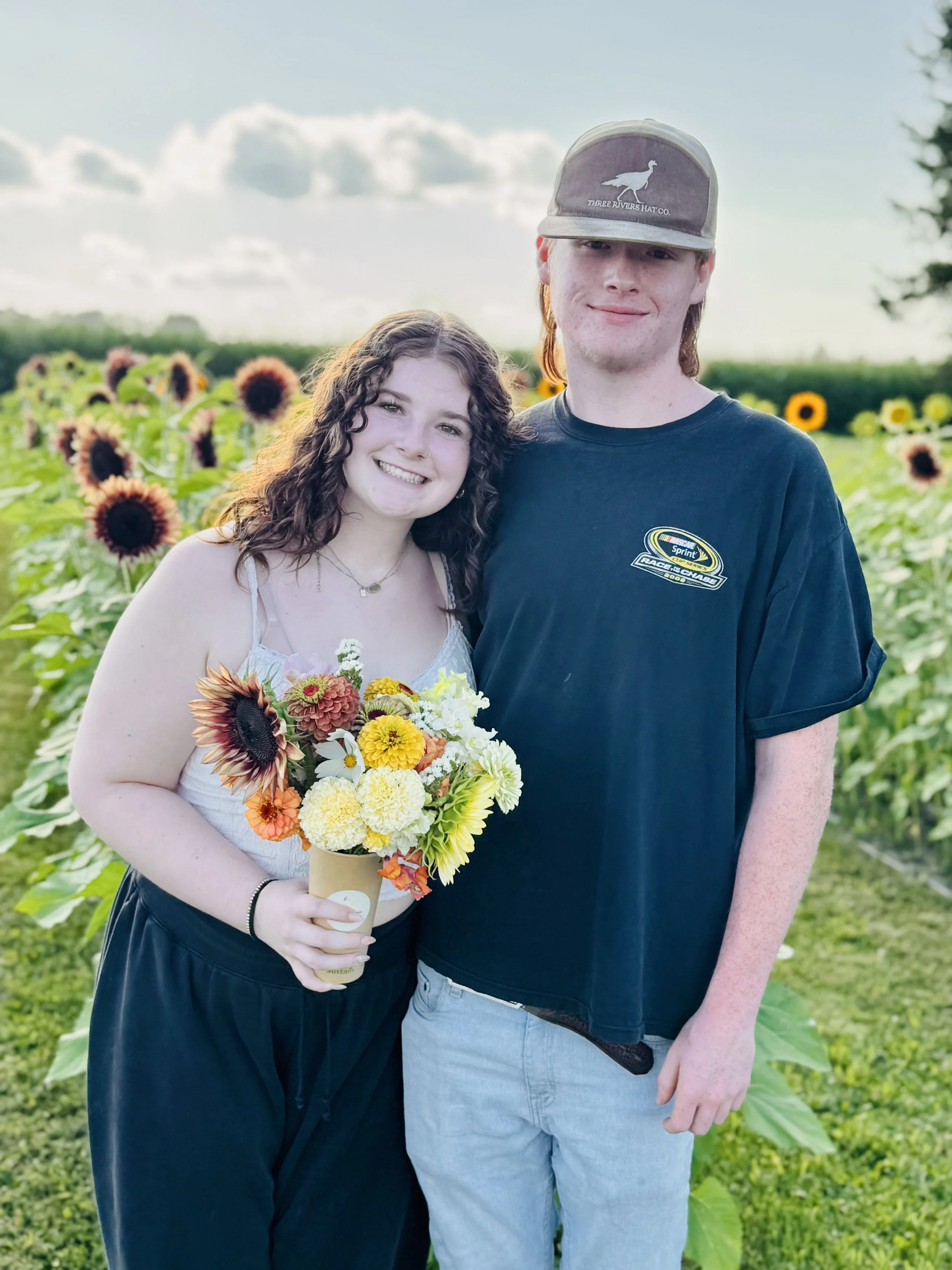 Couple visiting u-pick flower field at Northern Frost Farm