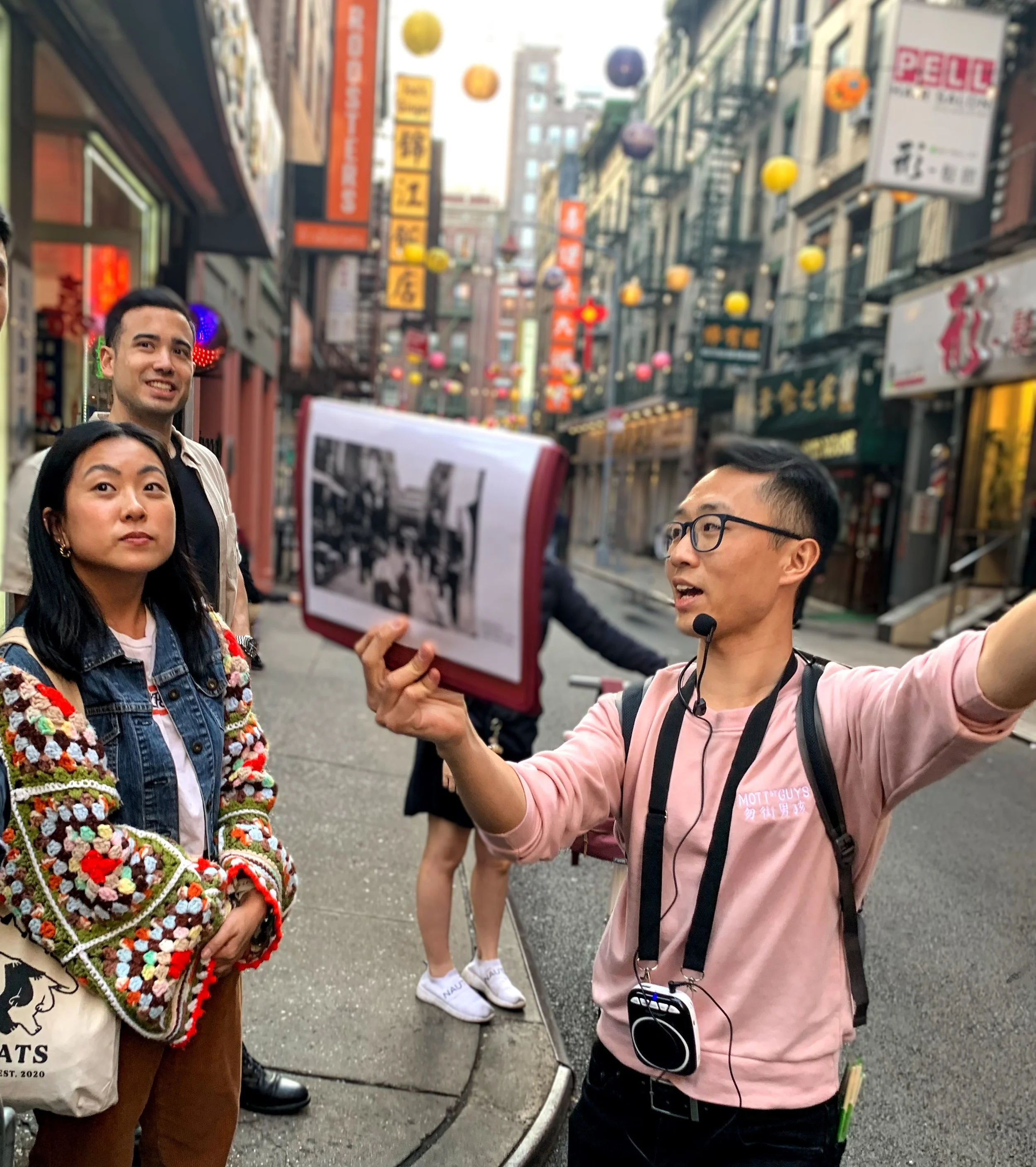 A photo of the author, Roger Lam, taking a group of Asian American tourists on a tour in NYC Chinatown.