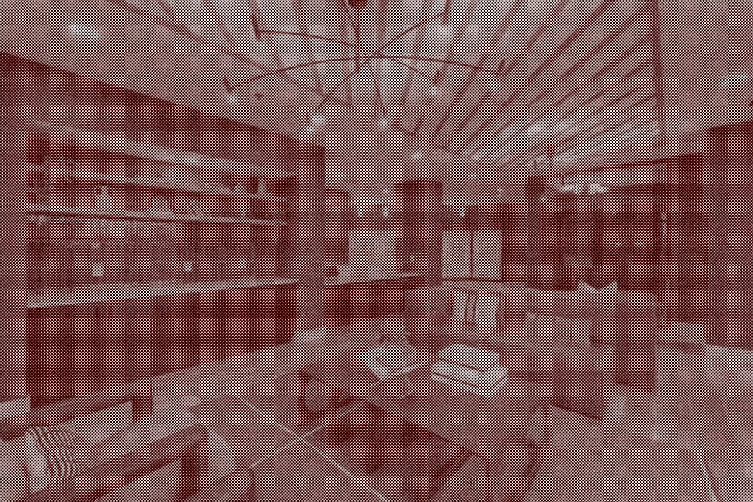 Interior view of a room with bookshelves, a table, a spiral staircase, and a tiled floor, suggesting a library or study area.