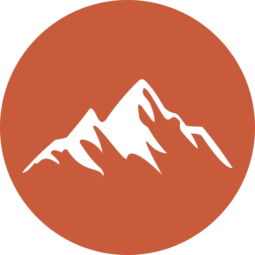 A white mountain icon on a red circular background.