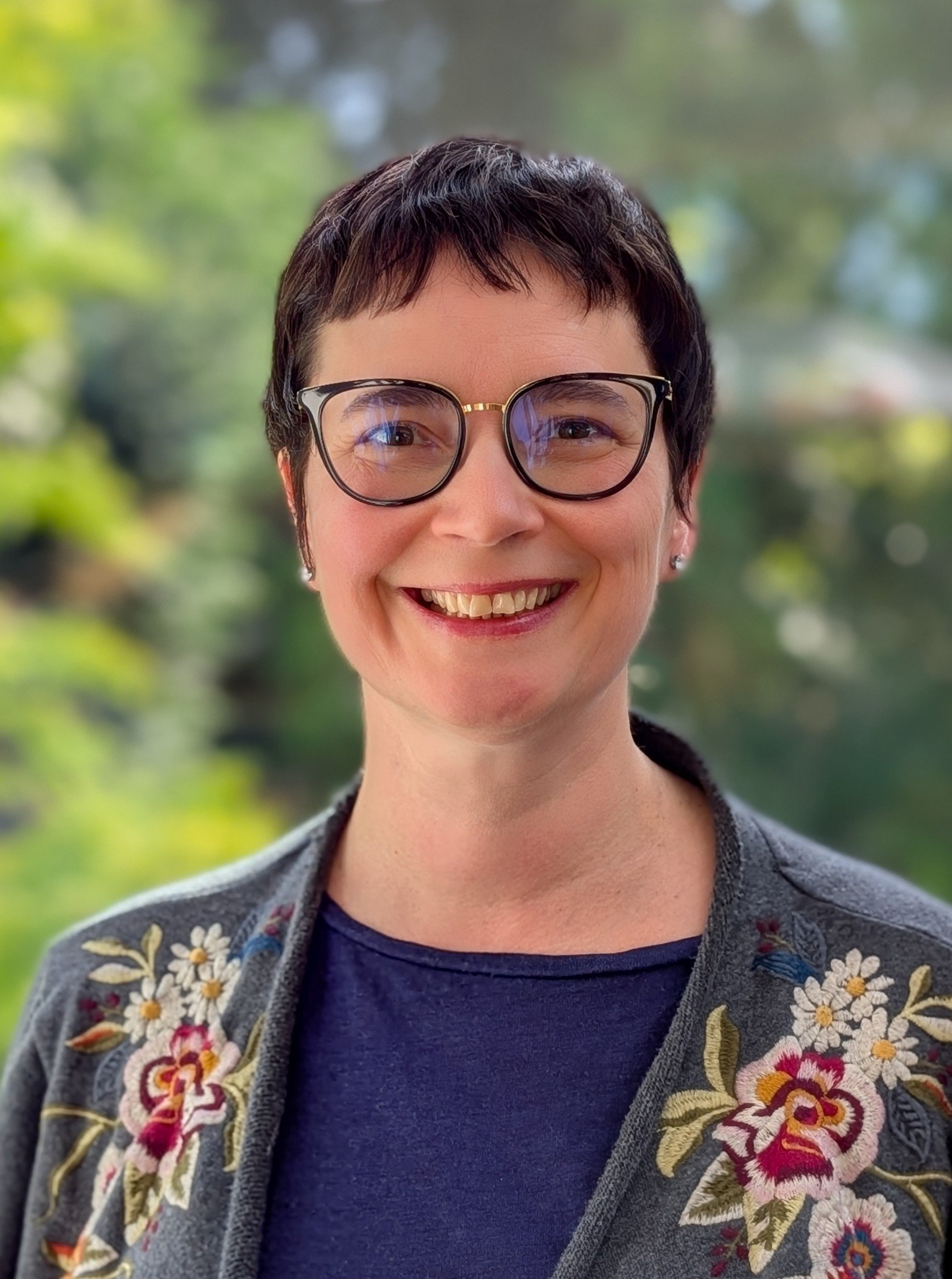 Hermione Carsten, KonMari Consultant-in-Training, smiling warmly.