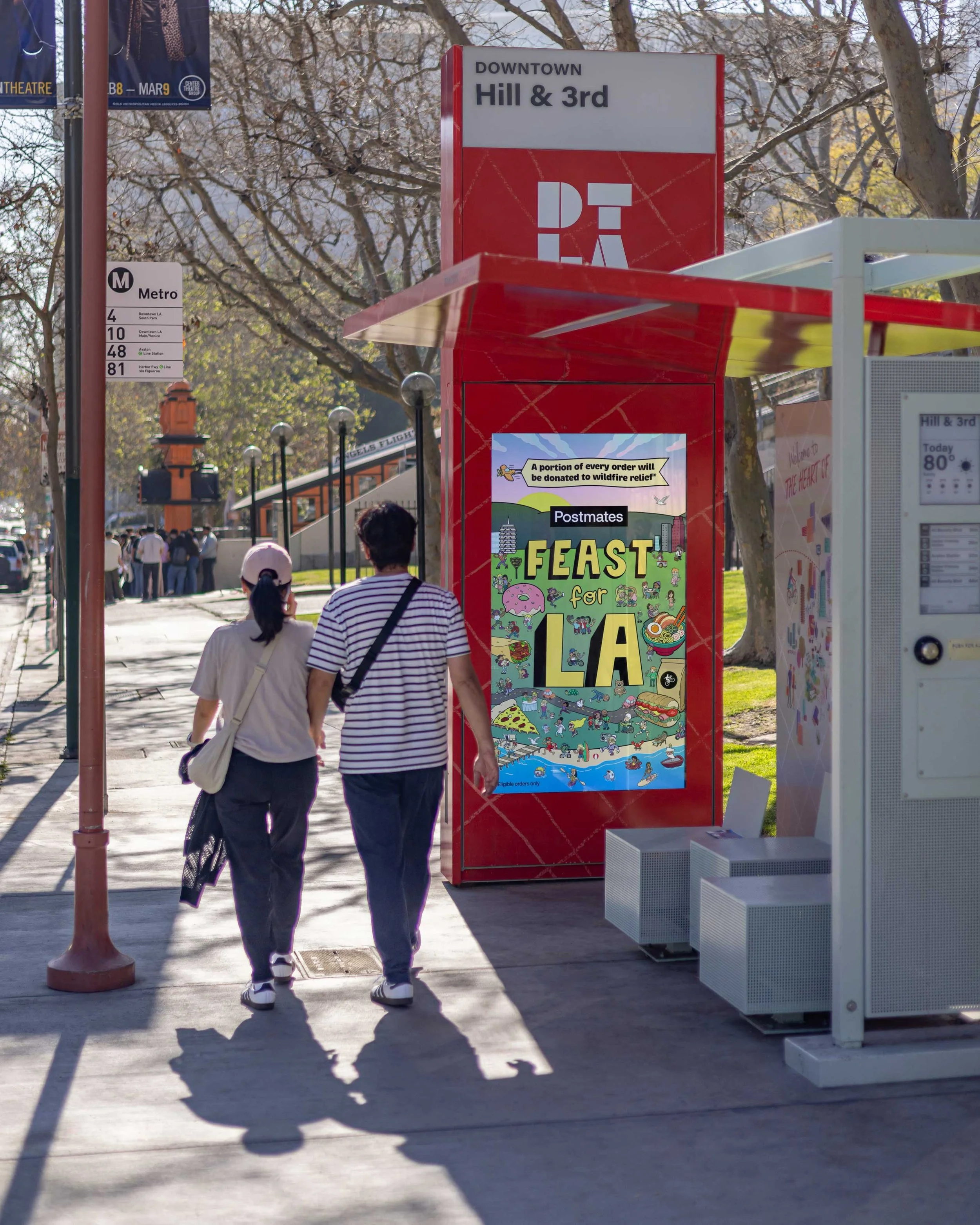 Postmates Feast For LA campaign poster displayed at a street transit shelter bus stop in Los Angeles — OOH outdoor advertising installation by Danvillage illustrator Daniel Sulzberg