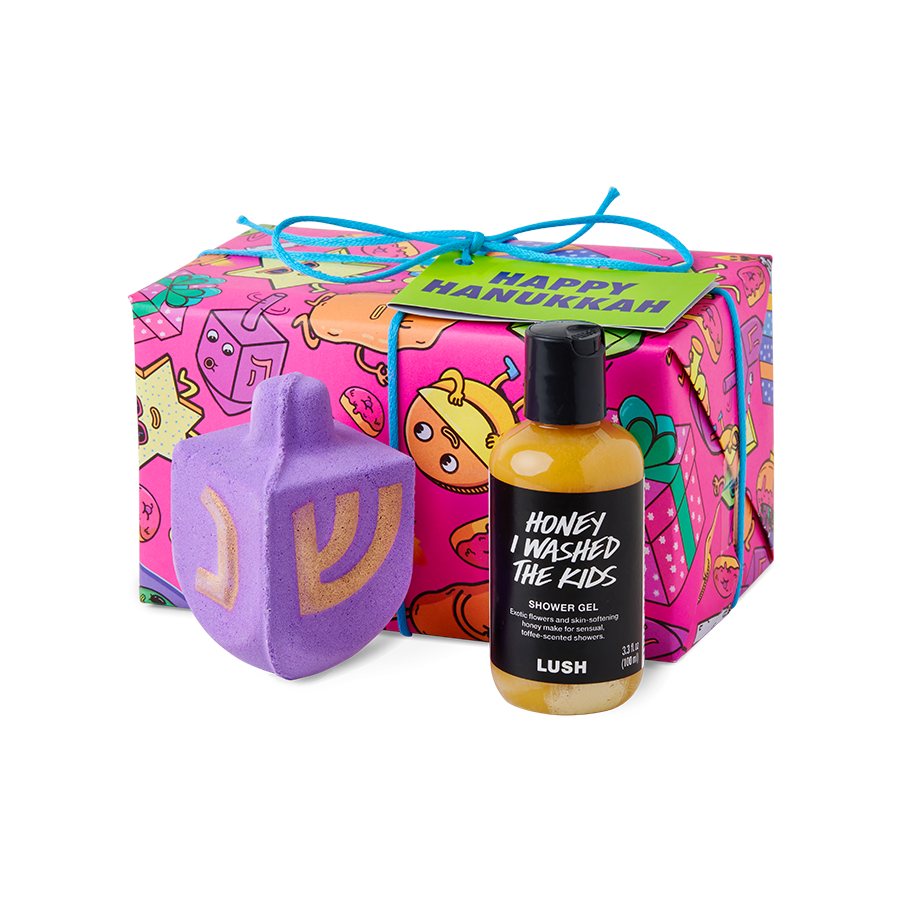 Lush Soap seasonal Hanukkah gift box and product with Danvillage Knotwrap illustration — dreidel-shaped packaging featuring Happy Hanukkah character artwork