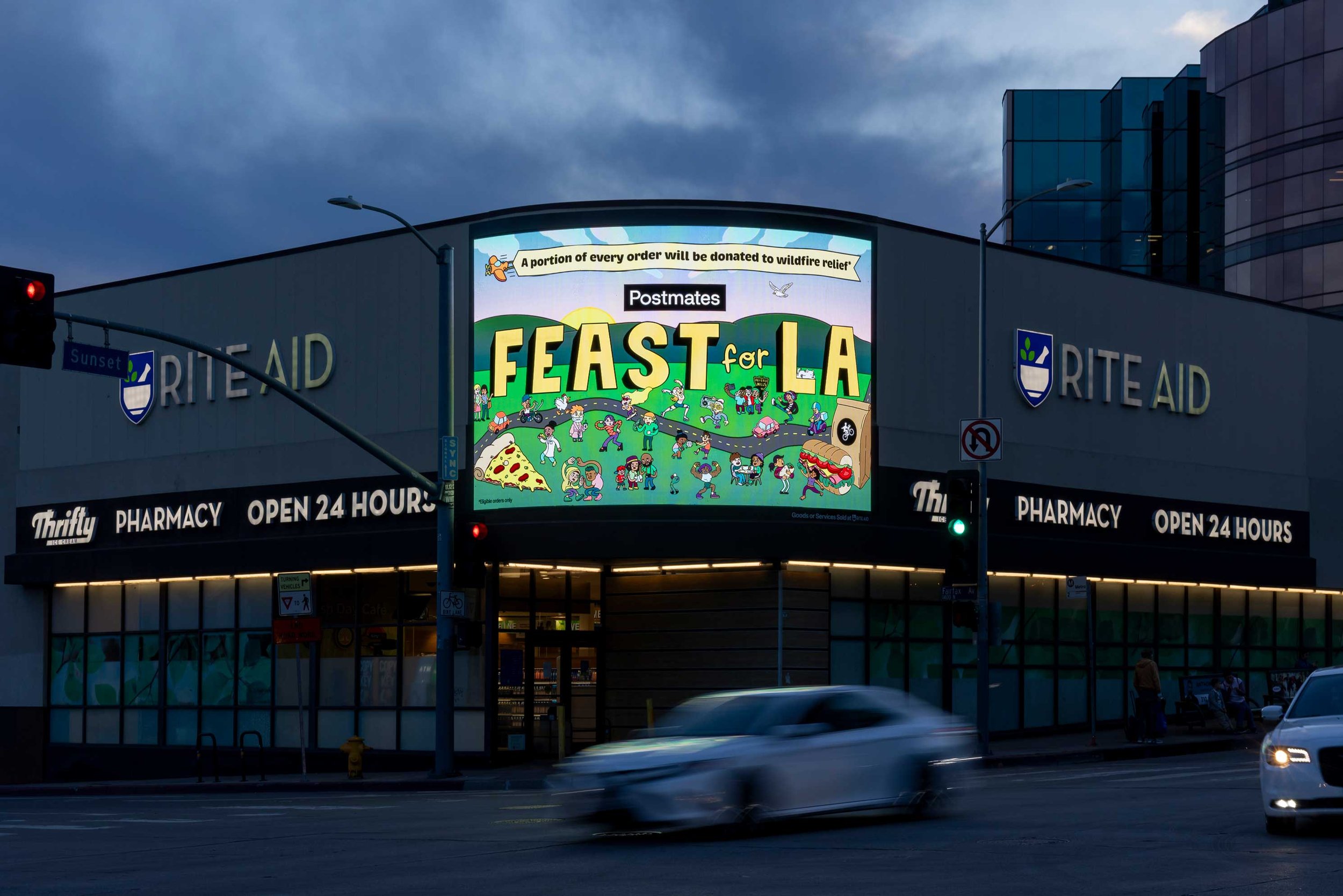 Postmates Feast For LA campaign illustration displayed on a large digital billboard at a Los Angeles shopping center at dusk — outdoor advertising by Danvillage illustrator Daniel Sulzberg