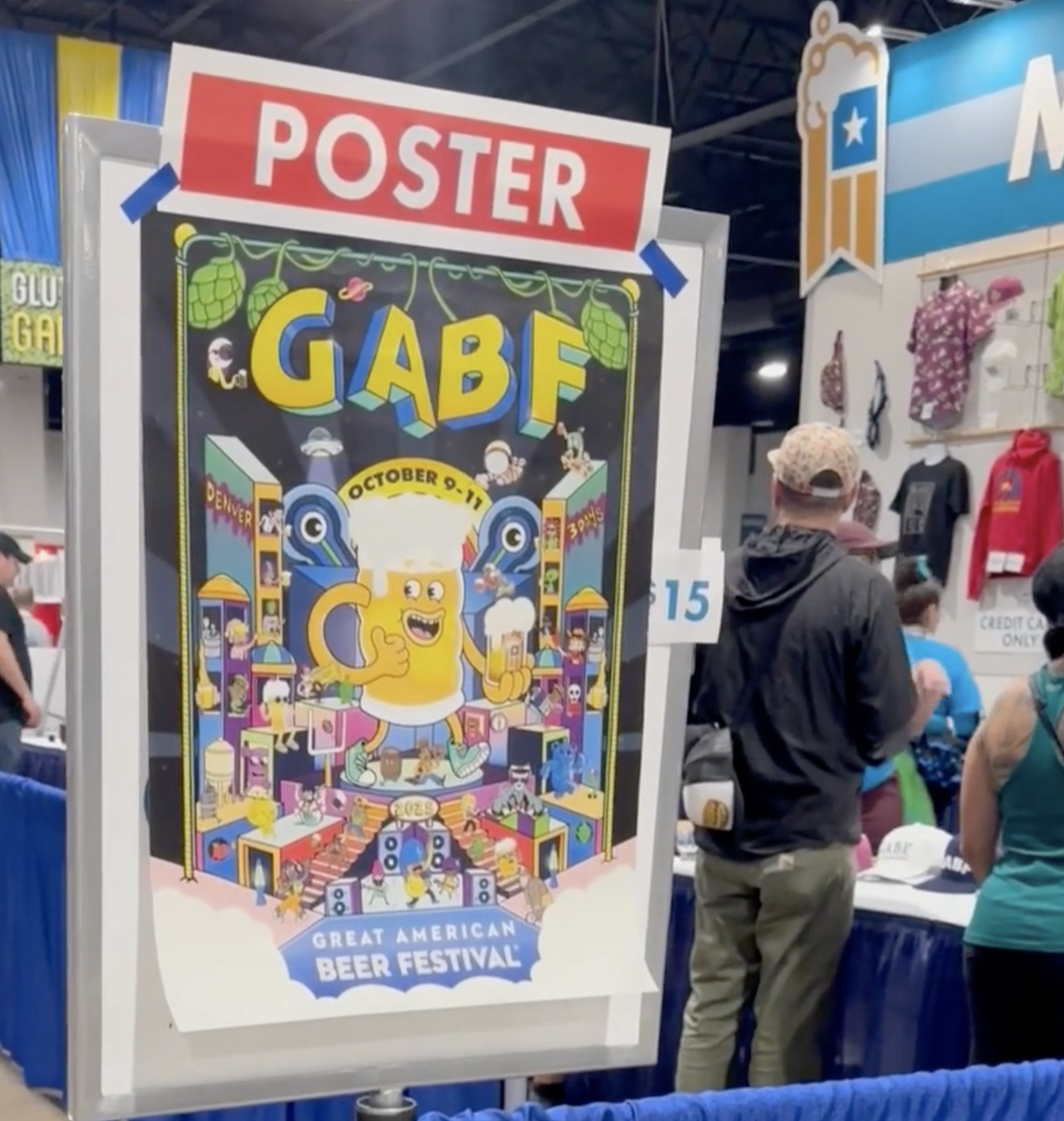 Official GABF 2025 poster display at the Great American Beer Festival booth, illustration by Danvillage artist Daniel Sulzberg