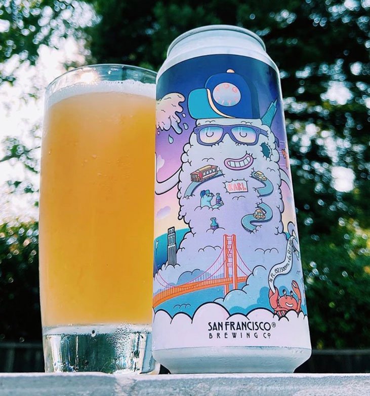 Fog City Hazy IPA beer can by San Francisco Brewing Co. poured into a glass — label illustration by Danvillage featuring Karl the Fog character design