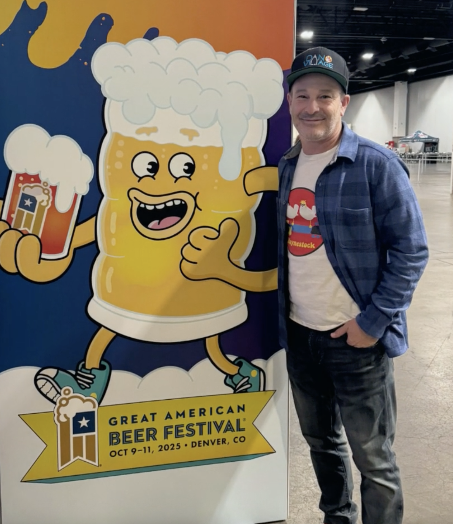 Festival goer posing next to GABF beer mug mascot cutout at the 2025 Great American Beer Festival, illustration by Danvillage