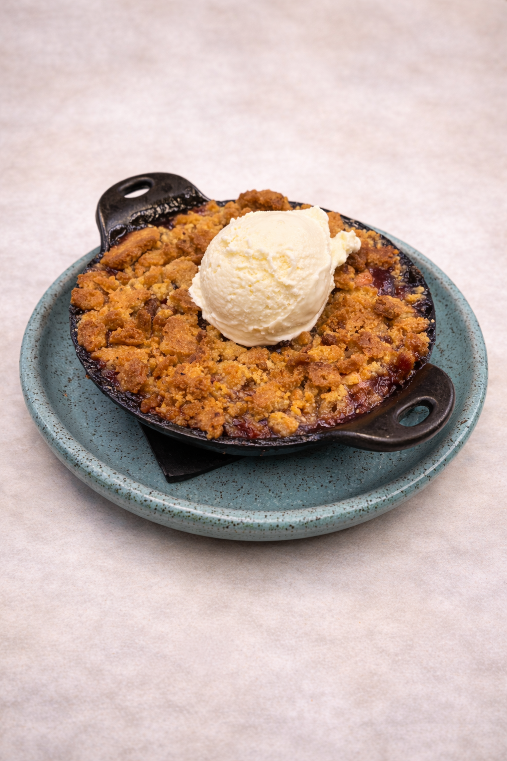 Apple, Strawberry, and raspberry cobbler with vanilla ice cream