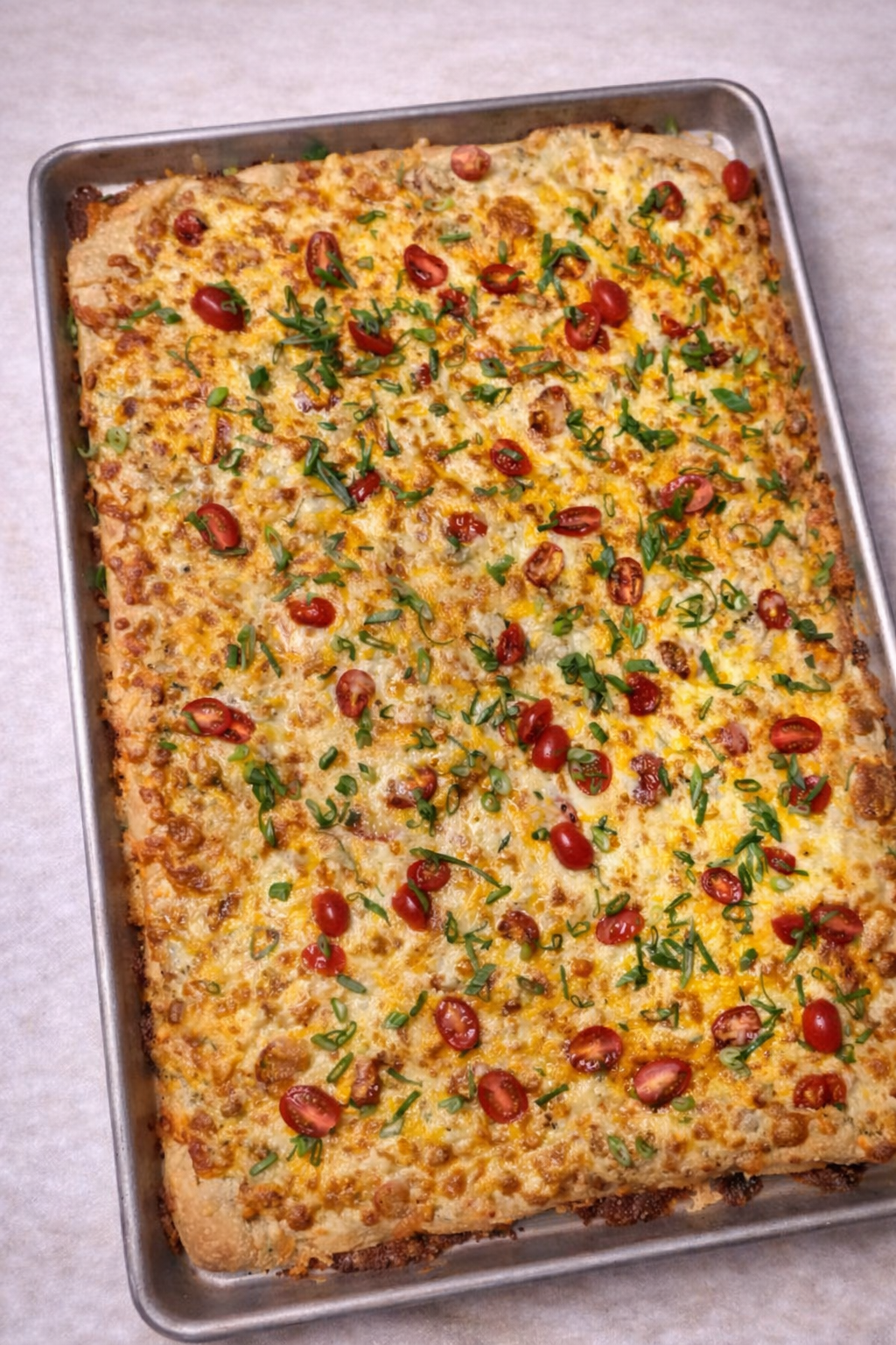 Crab and sherry bechamel flat bread pizza with spring onion and cherry tomato