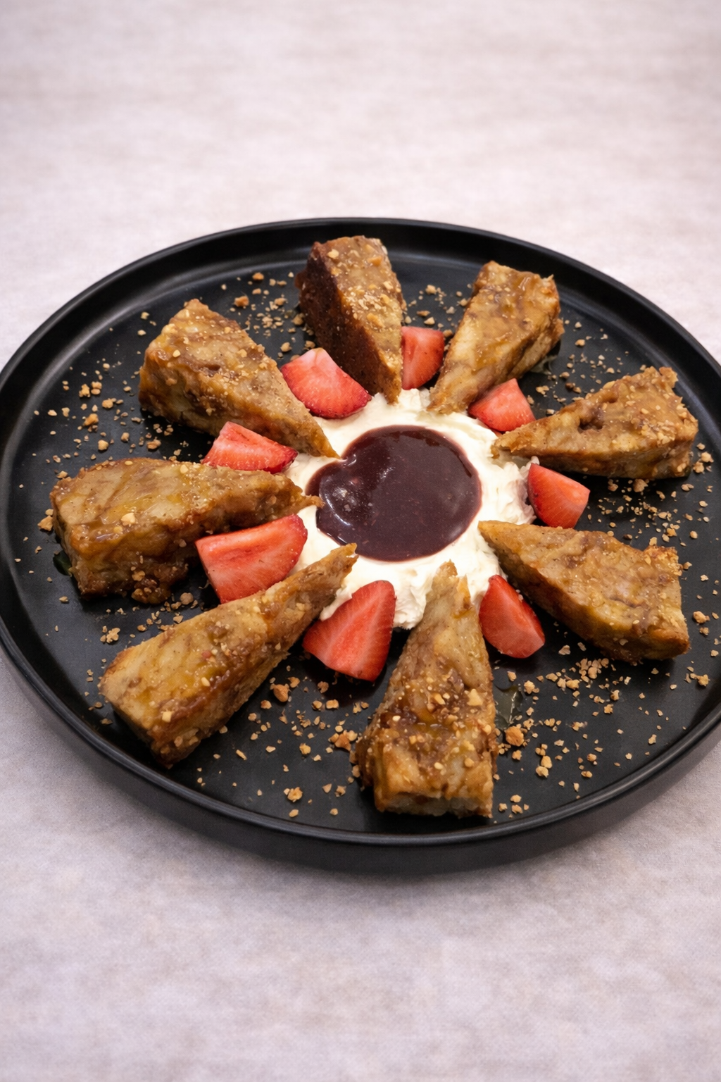 Cinnamon spiced bread pudding and strawberry around a bed of whipped mascarpone and an apple, cranberry puree 