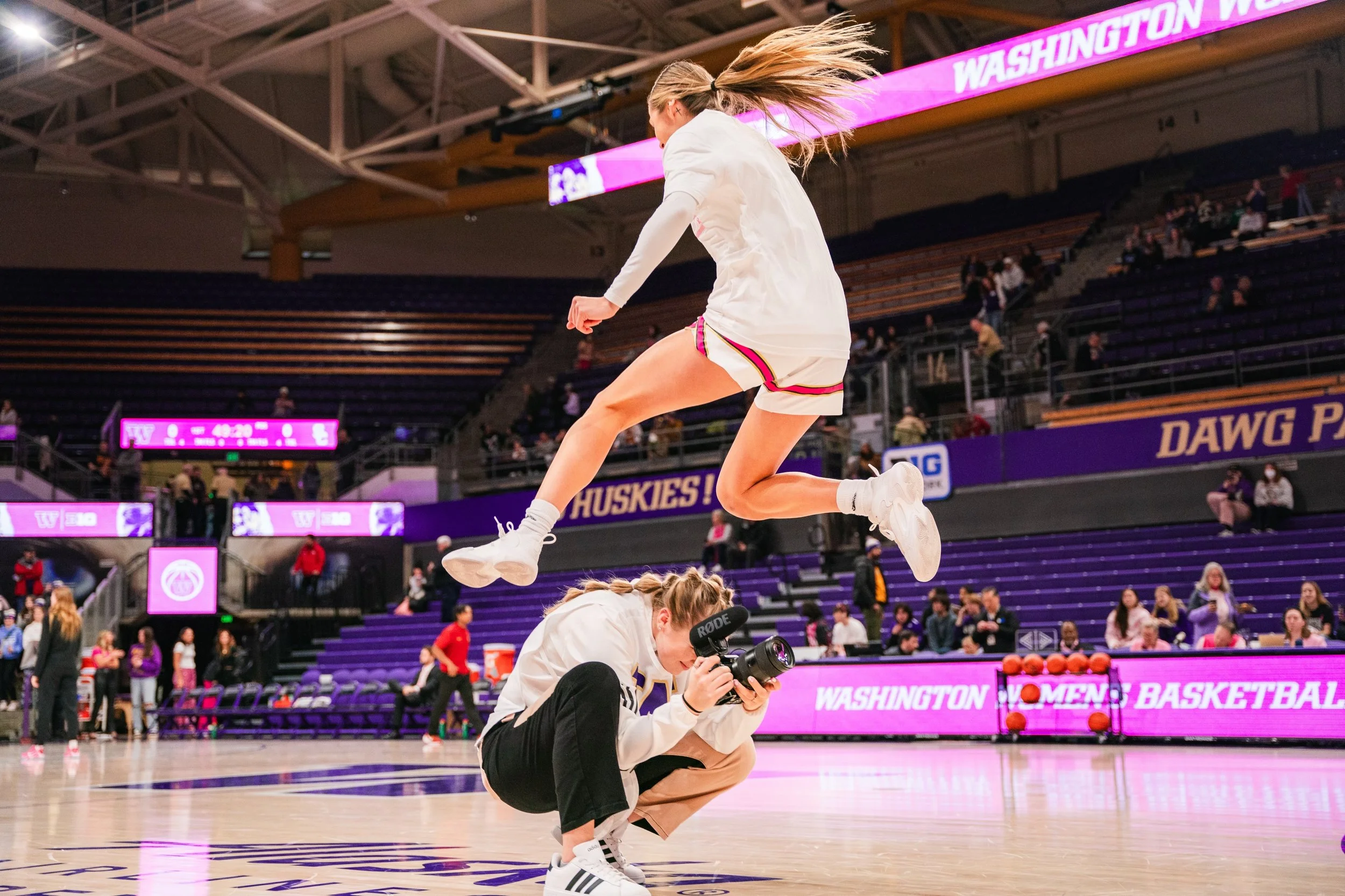 Laryssa Myers, shooting sports coverage during warmups on the court. Professional sports videographer and photographer