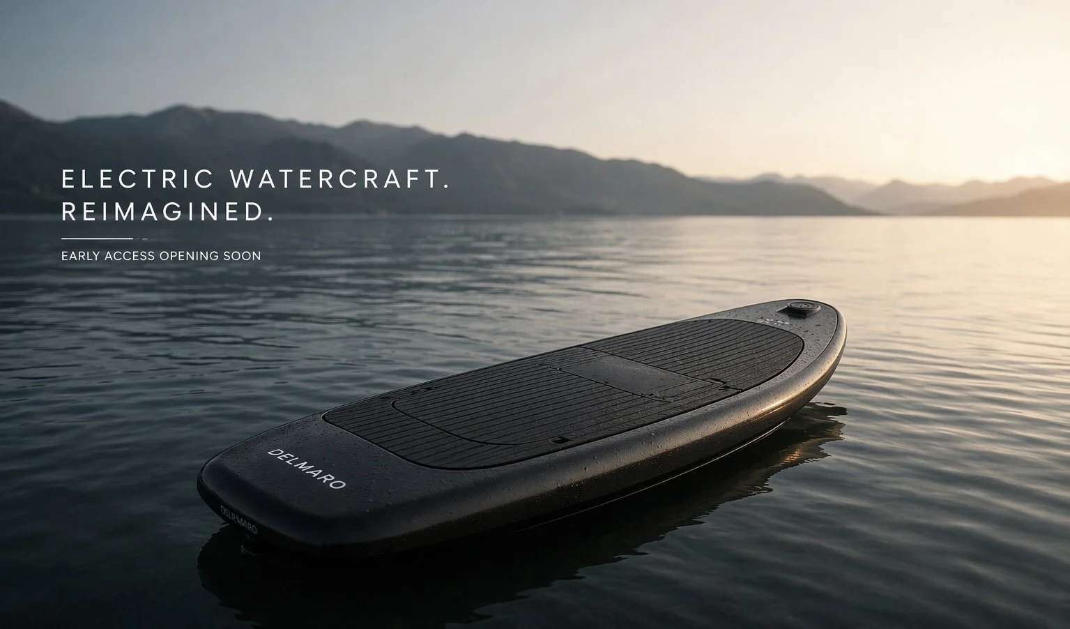 A black electric watercraft  jet board on calm water near a mountain range at sunset
