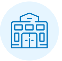 Icon of a building with multiple windows and doors, depicted in blue outline.