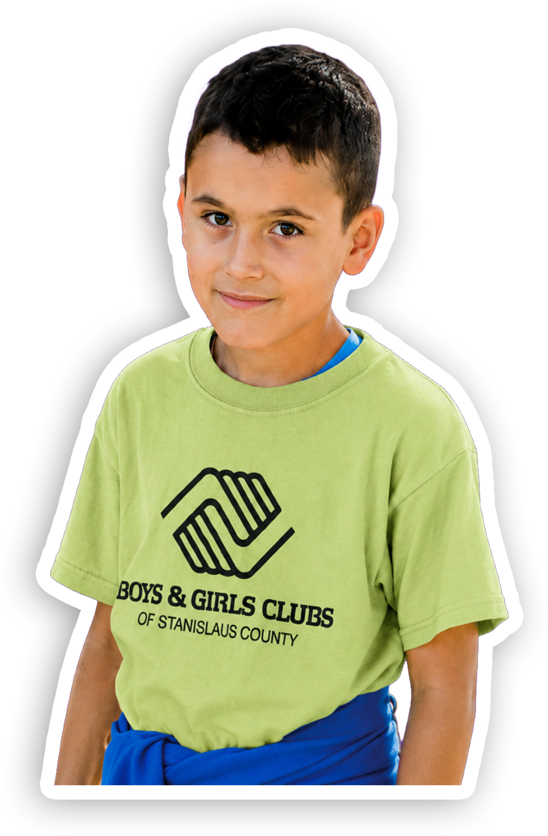 A young boy wearing a lime green T-shirt with the logo and text for Boys & Girls Clubs of Stanislaus County, with a blue shirt underneath, smiling slightly.