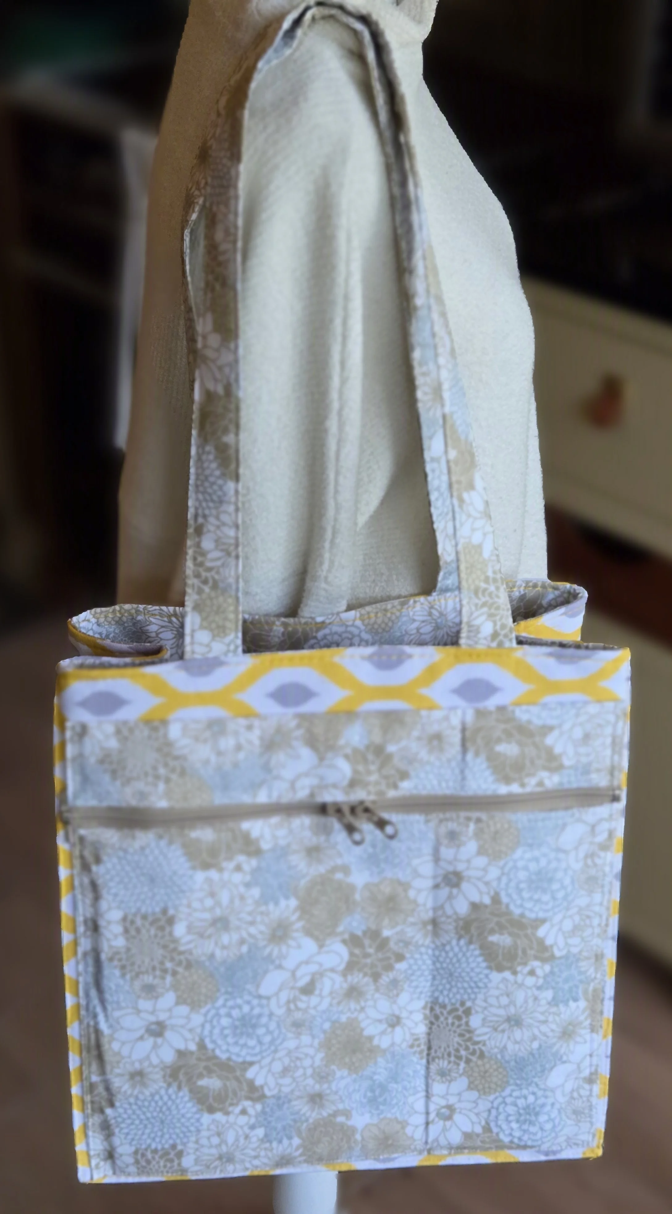 Fabric tote bag with floral pattern in white, gray, and yellow, dbfourdesign