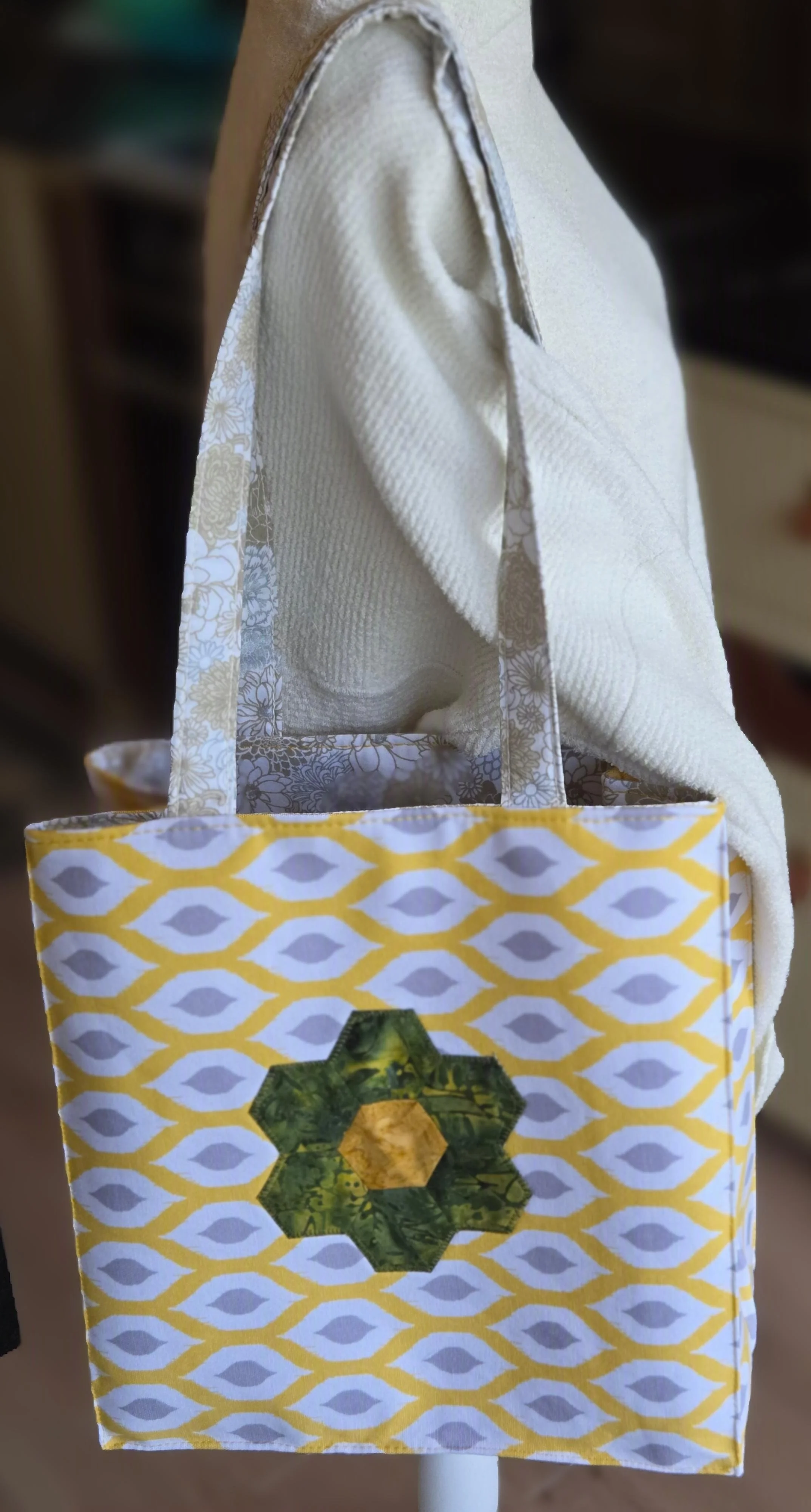 Yellow fabric tote with a green and yellow honeycomb applique.from dbfourdesign