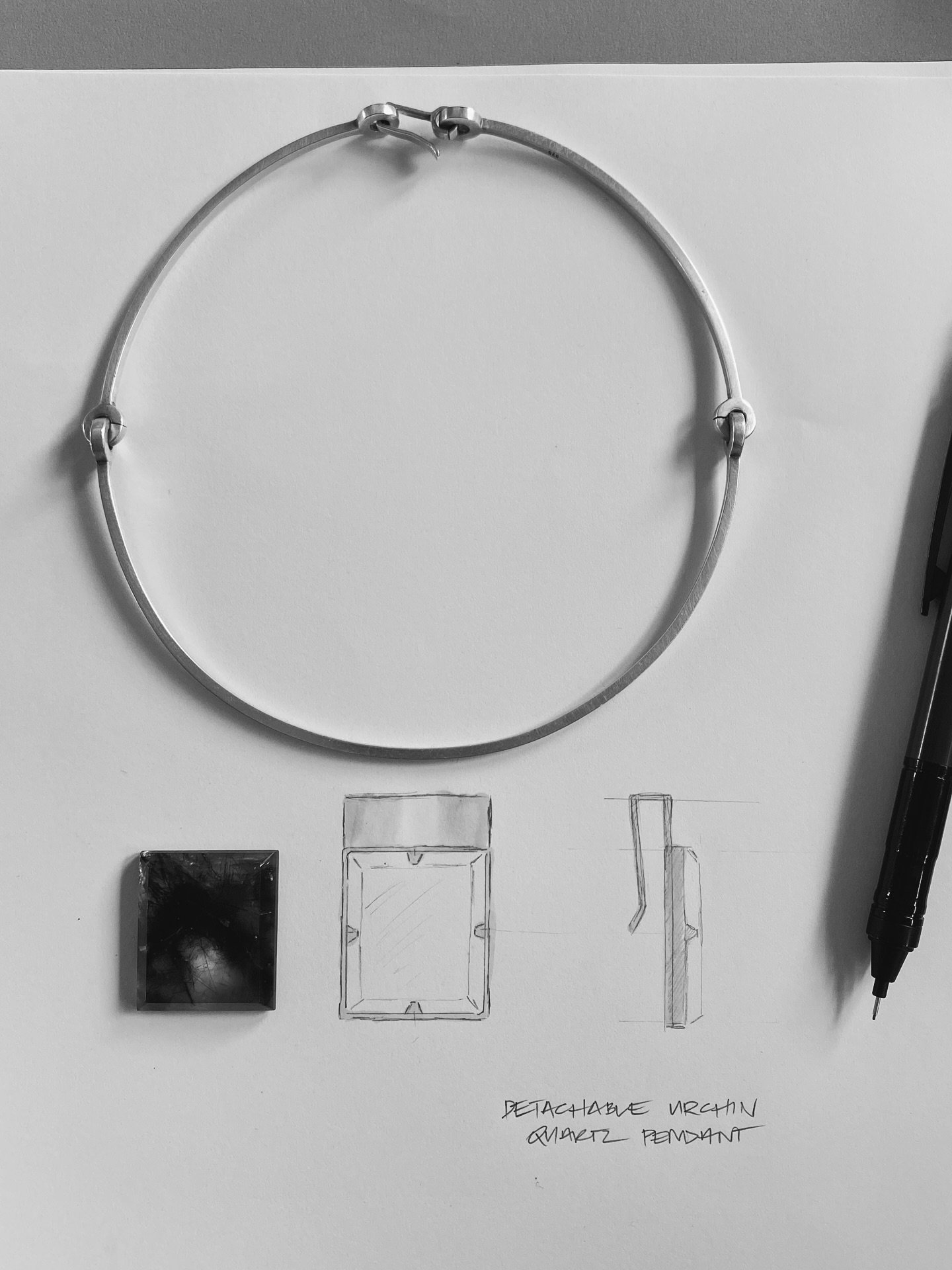 Concept Sketching.
Some gemstones ask very little of the design.

The beauty of this remarkable 55.68 carat Urchin Quartz specimen lies in its extraordinary natural inclusions. Rather than competing with them, I wanted the setting to frame the stone,