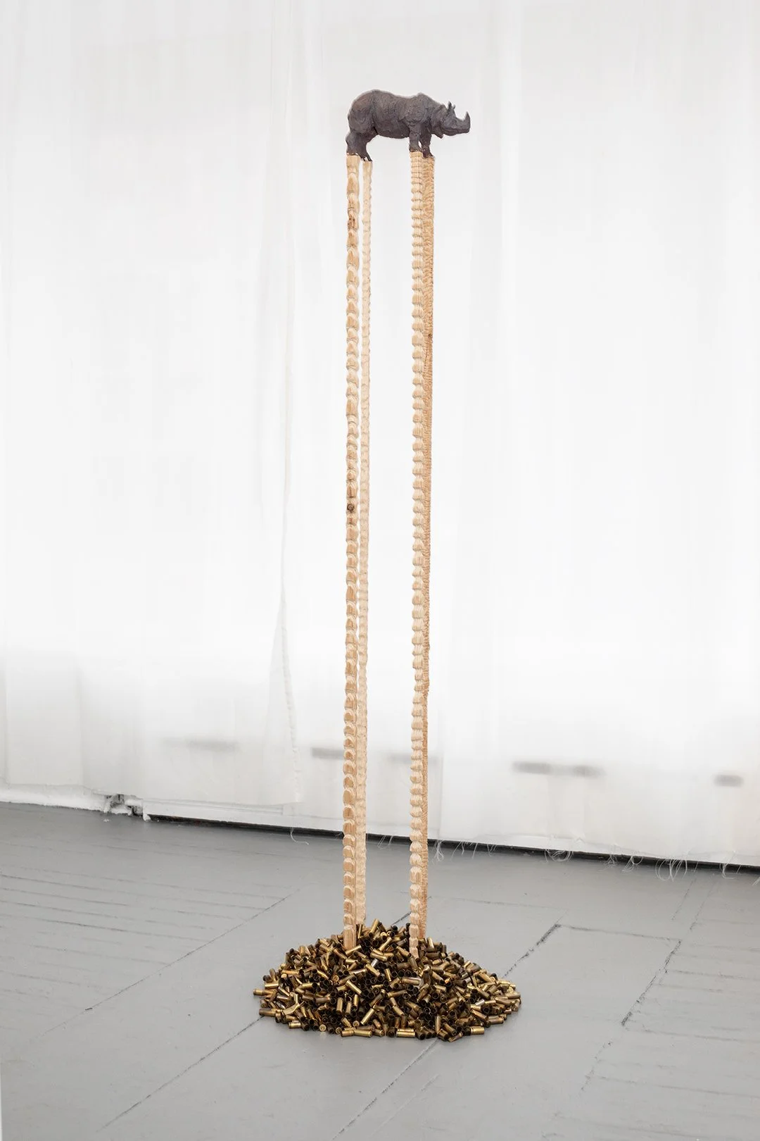 Rhino
Ceramic, wood, brass, plaster. 
58” x 12” x 12” 2018