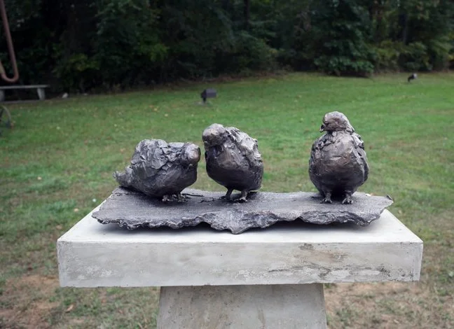 Pigeons (detail)
As installed at Burlington County Community College, Pemberton, NJ 2011

Three bronze pigeons on a concrete pedestal, surrounded by concrete pigeons on the ground.
