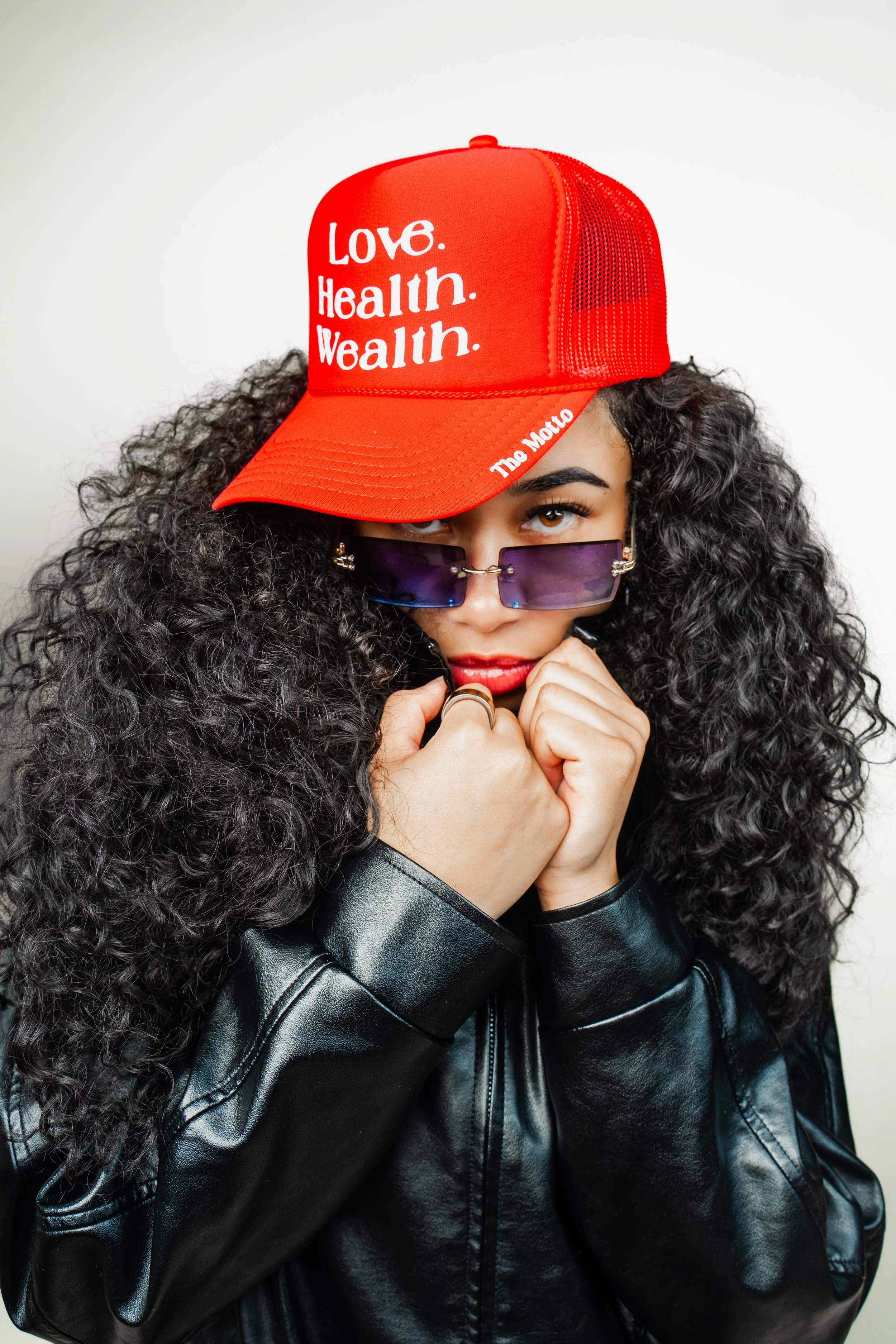 Woman styling BOI Collection hat, streetwear fashion look 