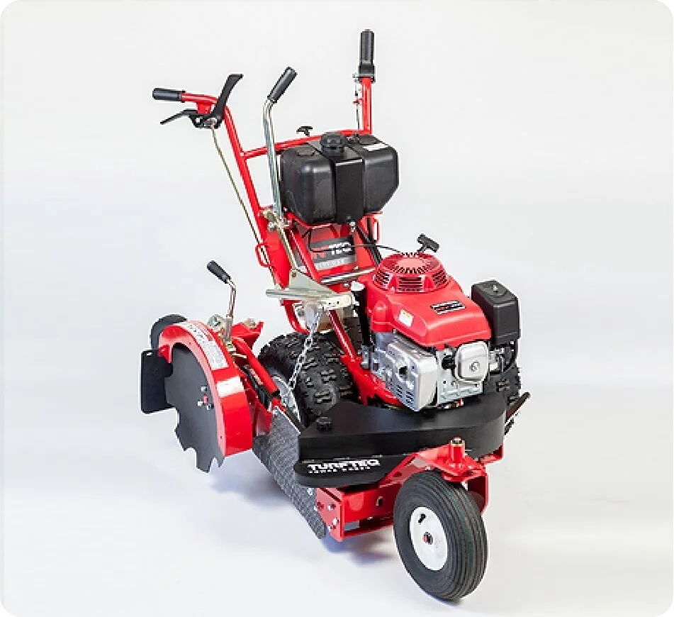 Red and black walk-behind trencher with a gas engine and large rear wheel on a plain white background.