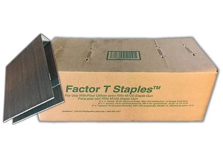 Box of Staples with four staple gun staples beside it.