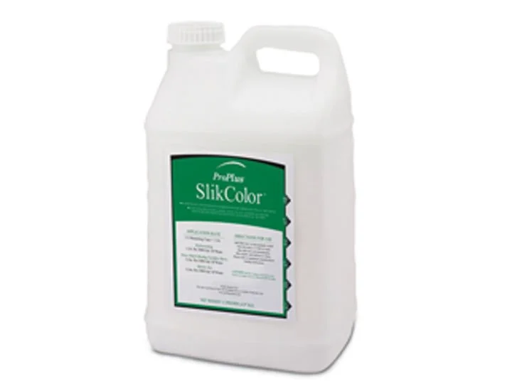 A white plastic container of ProFlo SlikColor liquid color dye with a green label.