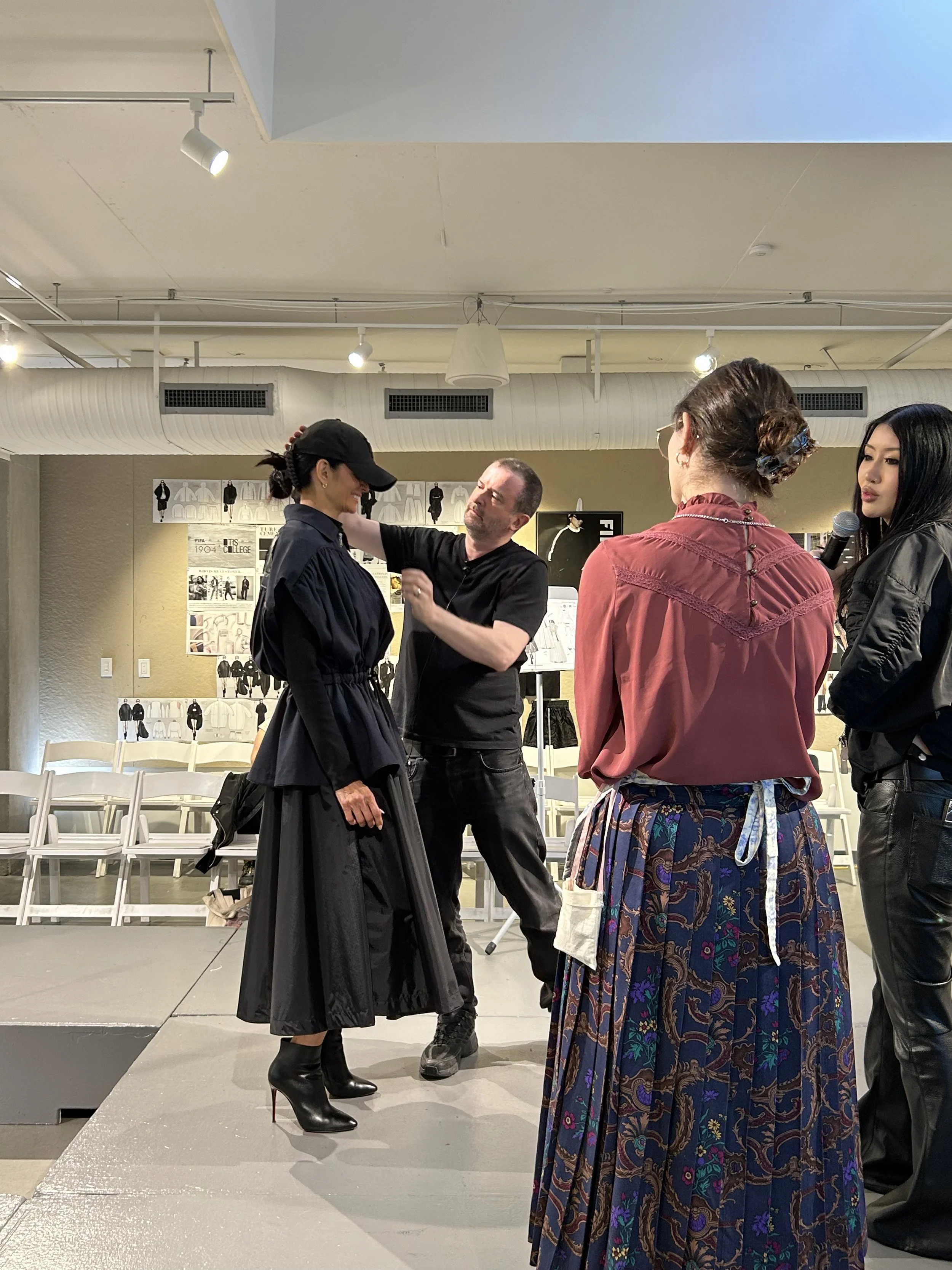 Second fitting; Marcus, Tessa, and Verona (left to right) discuss the look.