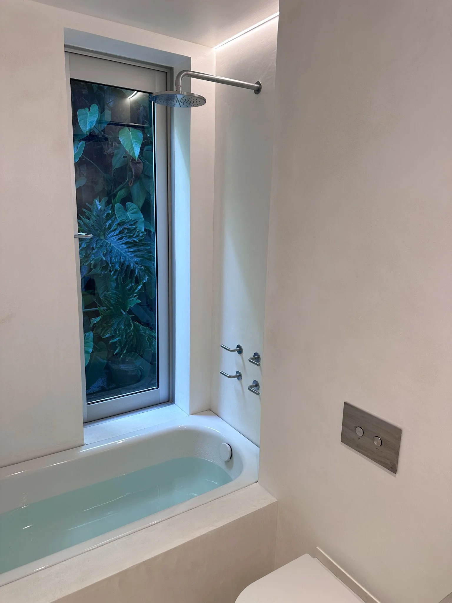 Residential bathroom renovation in Rushcutters Bay featuring a built-in bath and shower with modern fixtures and clean finishes.