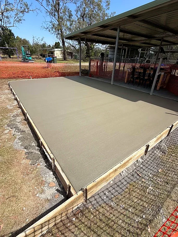 New concrete slab extension beside an existing covered outdoor area on a Mareeba property