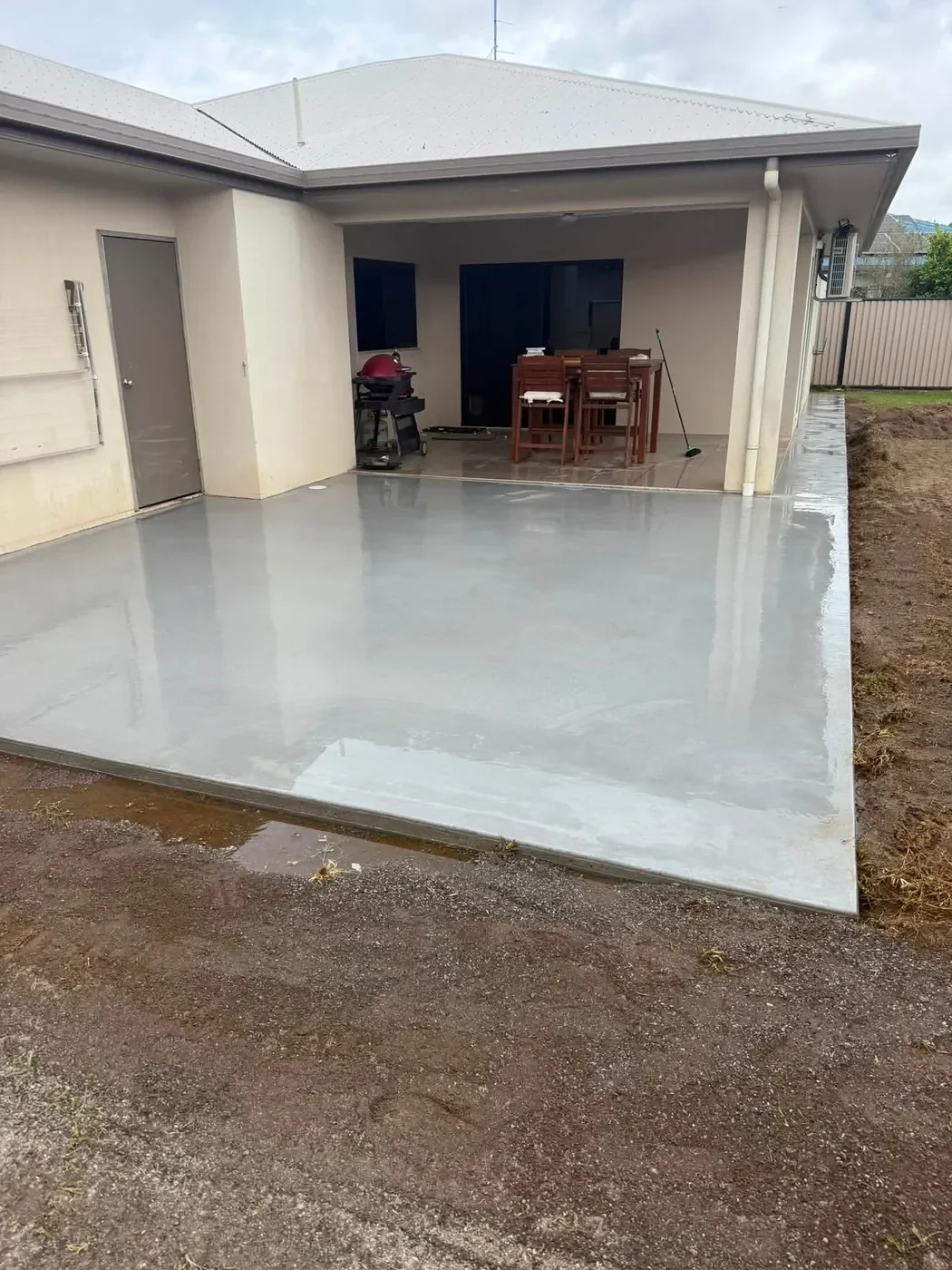 New concrete patio slab extending an outdoor living area on the Atherton Tablelands.