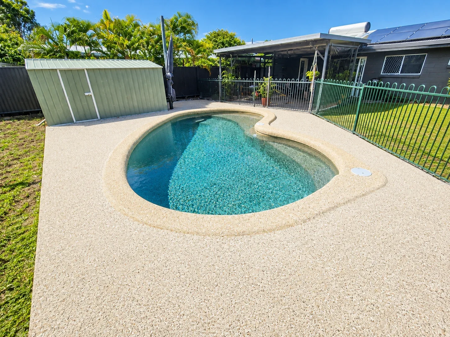 Exposed aggregate concrete pool surround at a residential property in Cairns
